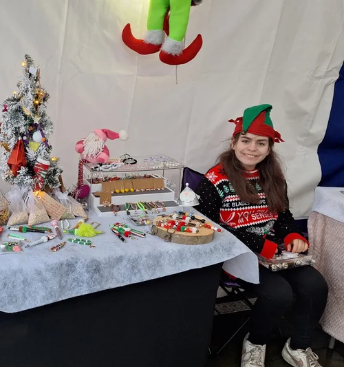 Ame showcasing her beaded jewellery and creations