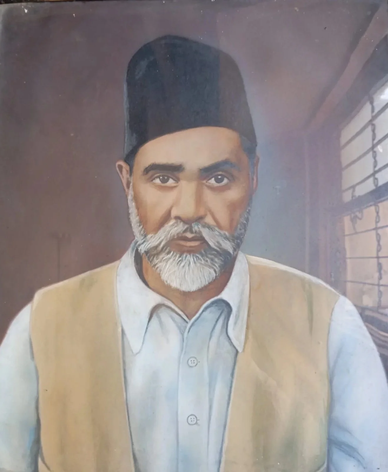 Painting of an older man with a gray beard wearing a white shirt and a yellow vest, inside a room with a window with bars.