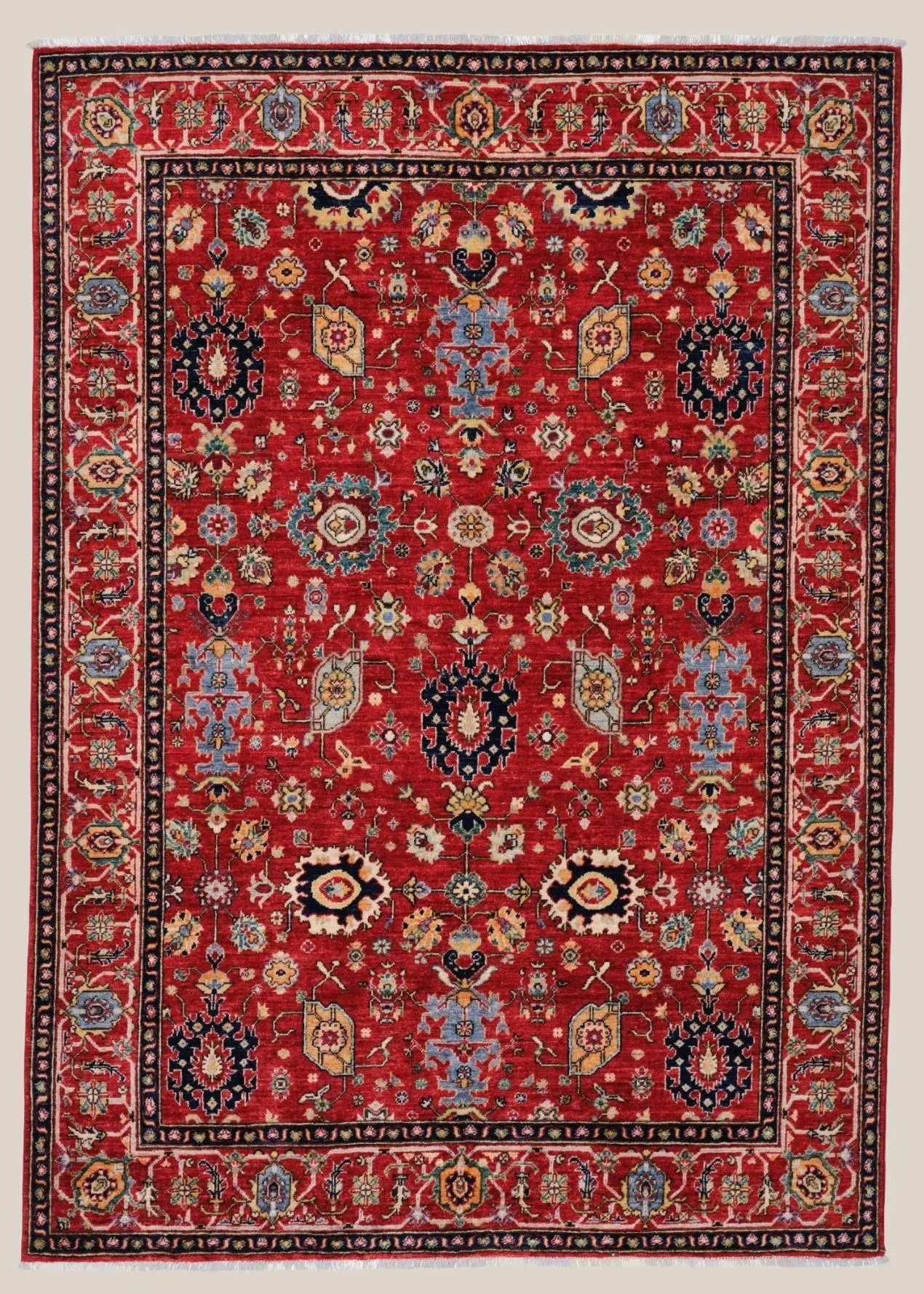 A traditional Persian-style area rug with a red background, intricate floral patterns in various colors, and a complex border design.