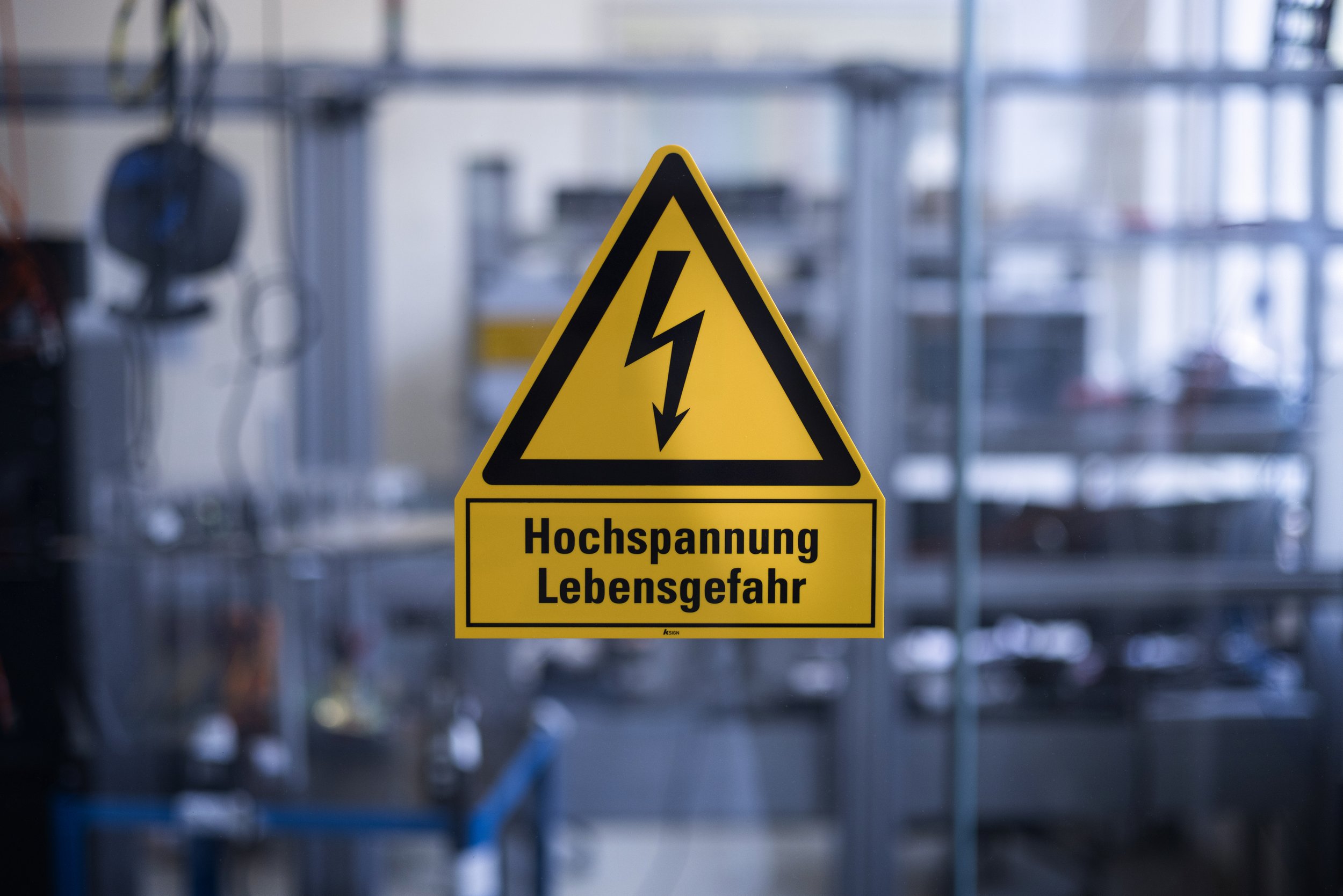 A pictogram with a lightning bolt and the text "Caution danger of death".