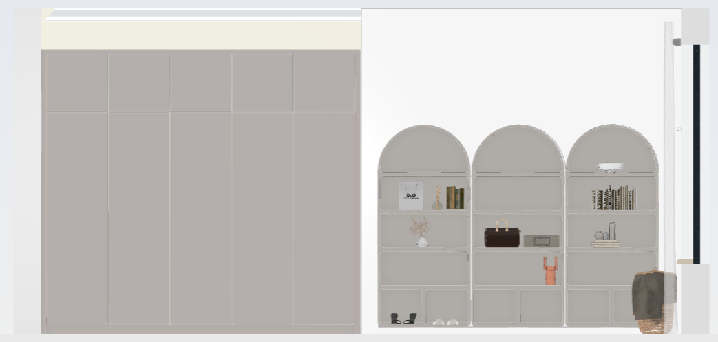 Interior view of a white wall with built-in shelving unit, including a large gray and white cabinet on the left and a white bookshelf with arched tops on the right, holding decorative items, books, and accessories.