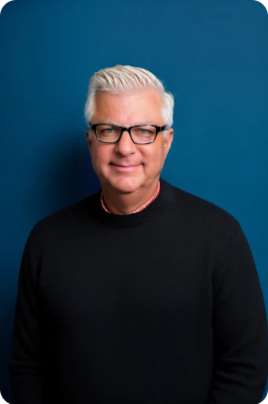 Man gray hair and glasses smiling