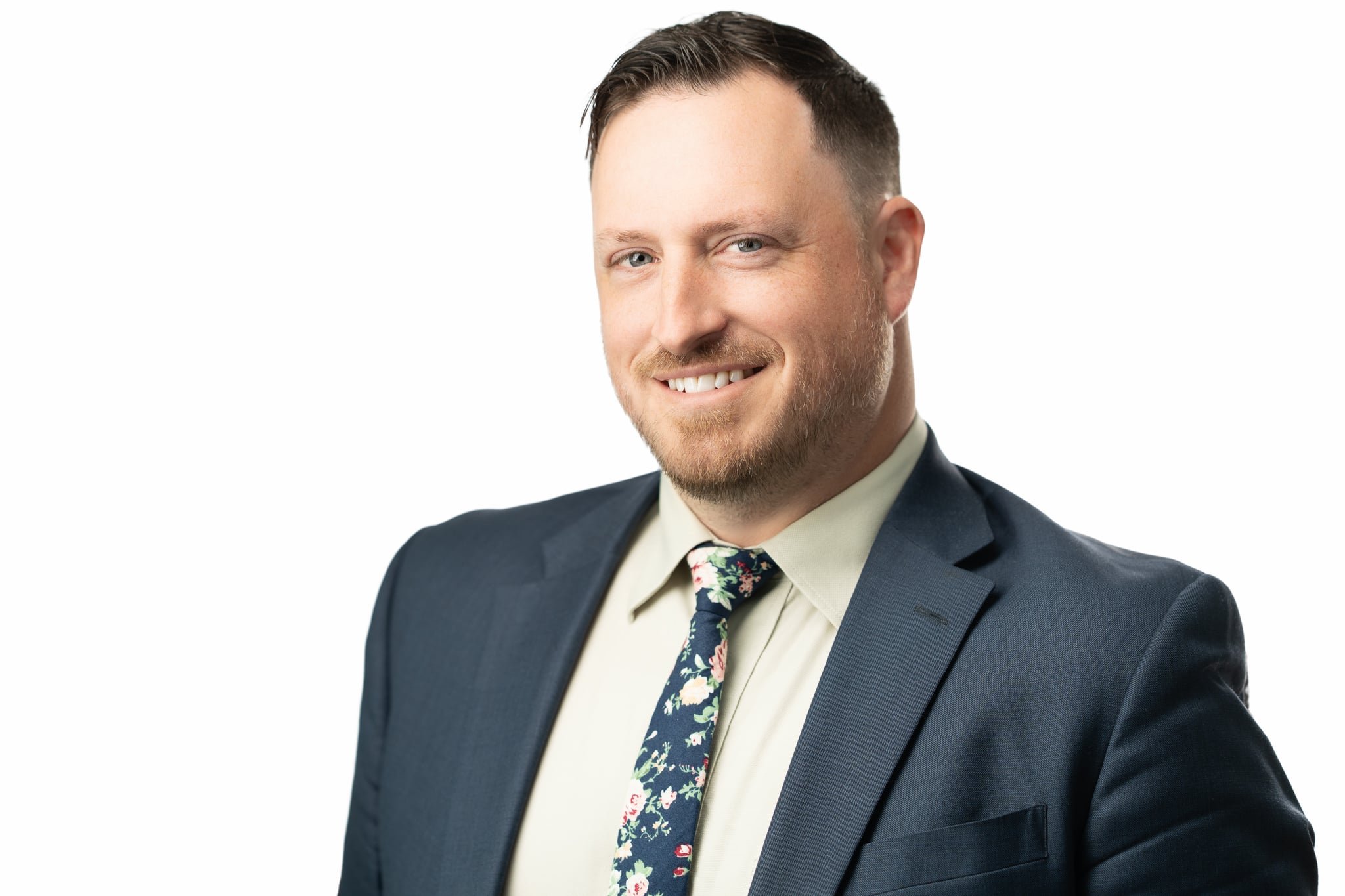 Man in suit and tie smiling