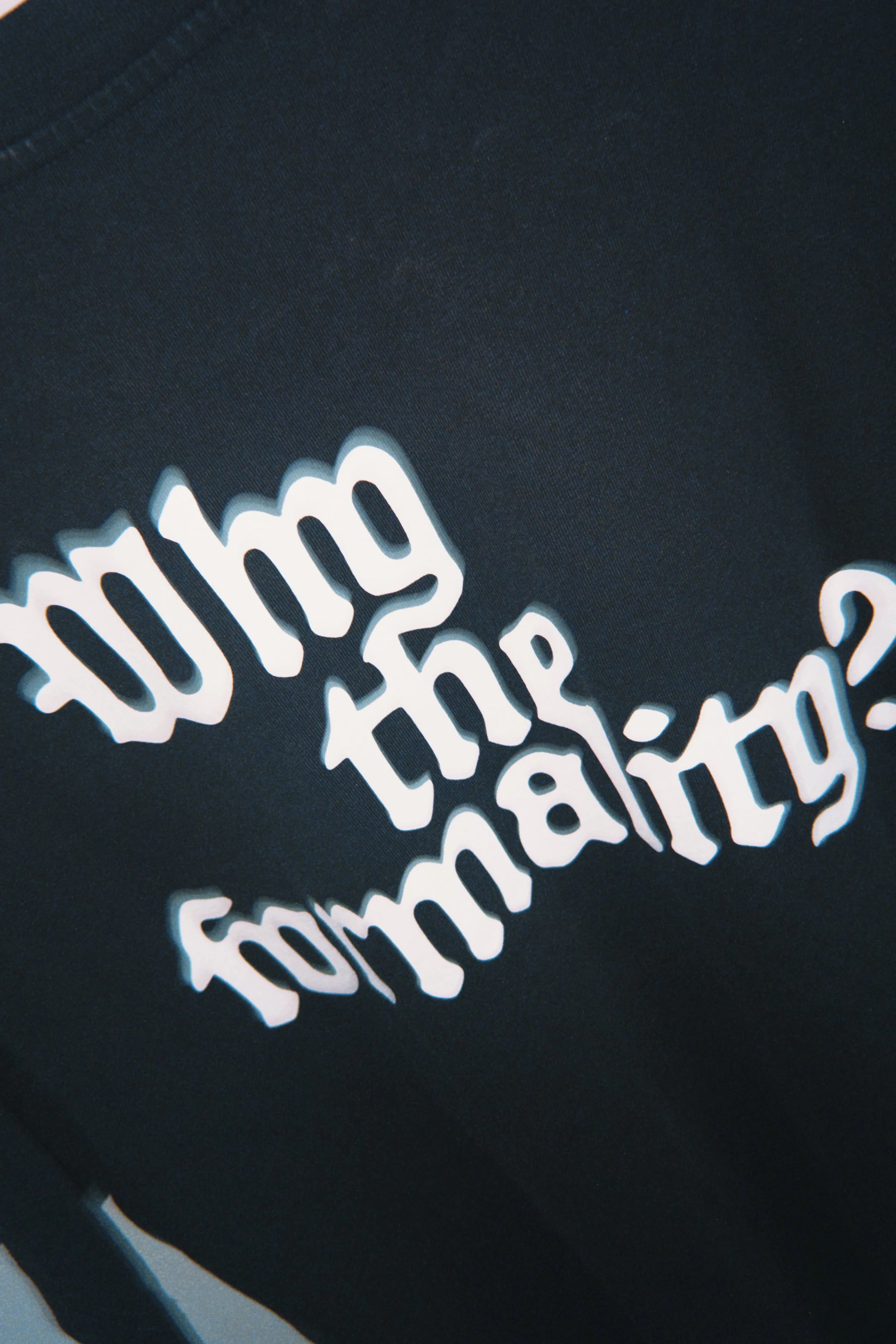 Close-up of a smiley face neon sign with the phrase 'going to the same' on a dark background.