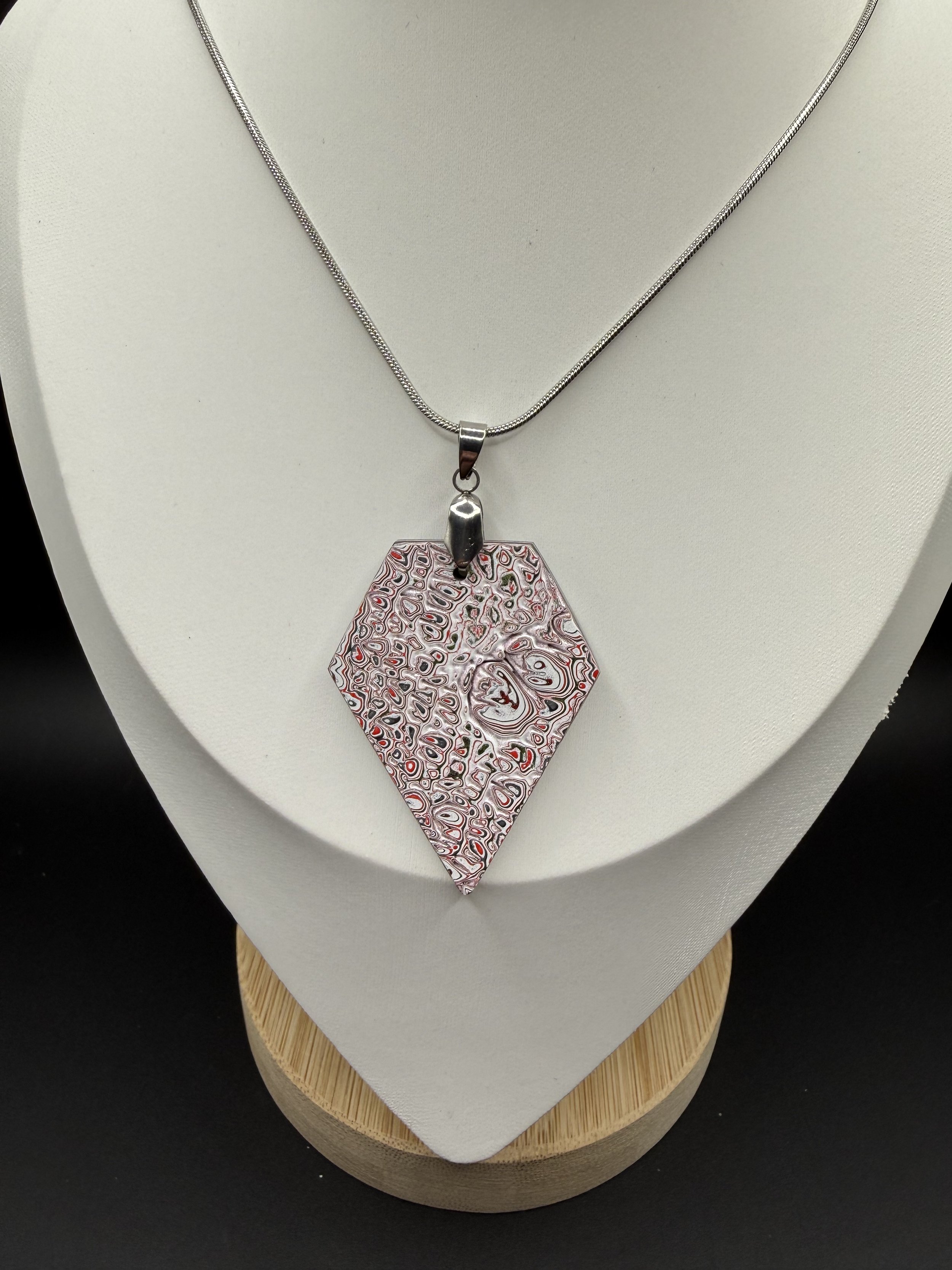 The Jeep Jem Handcrafted Jeep Fordite Pendant Necklace .jpeg