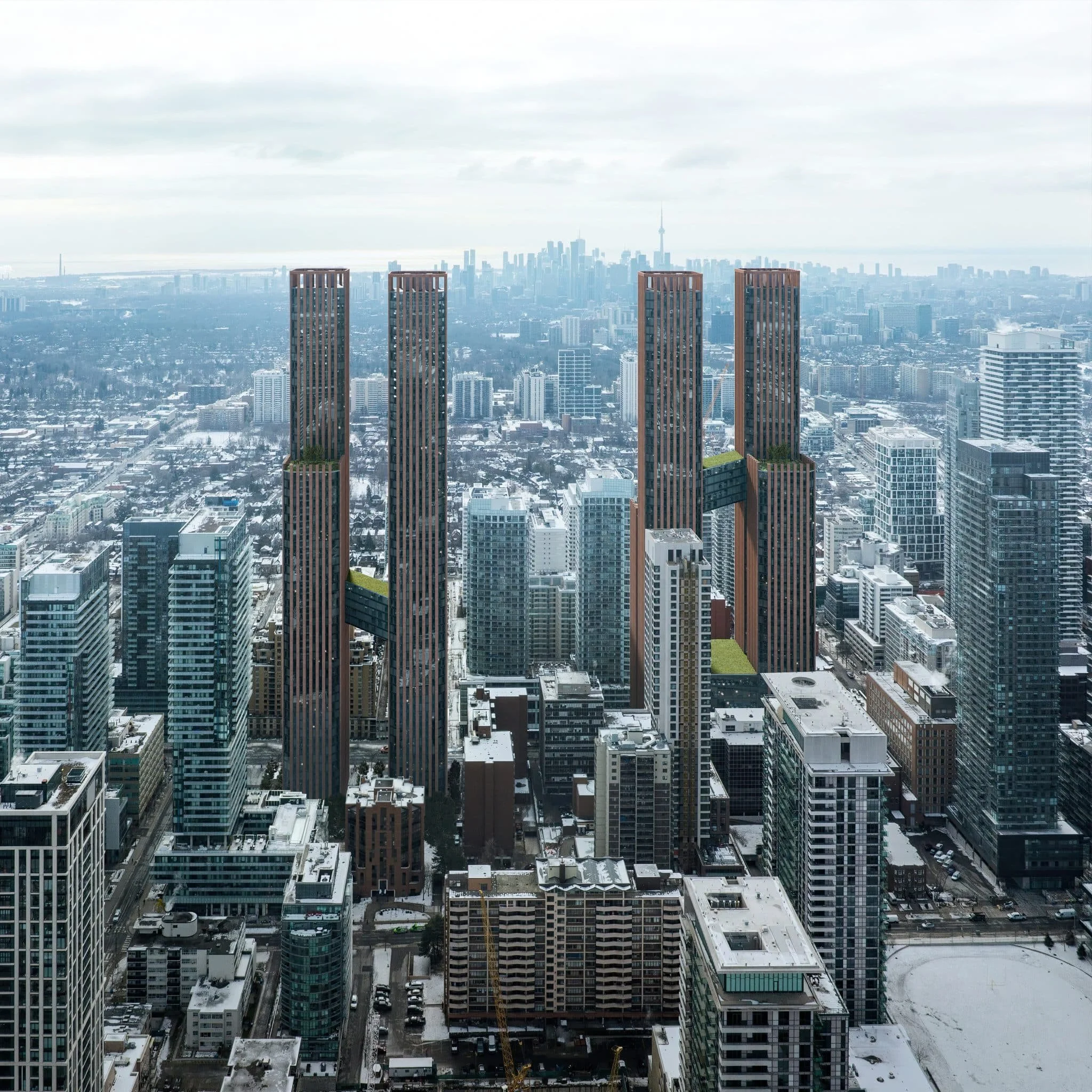 A city skyline with tall modern buildings under a cloudy sky, some buildings have snow on their rooftops.