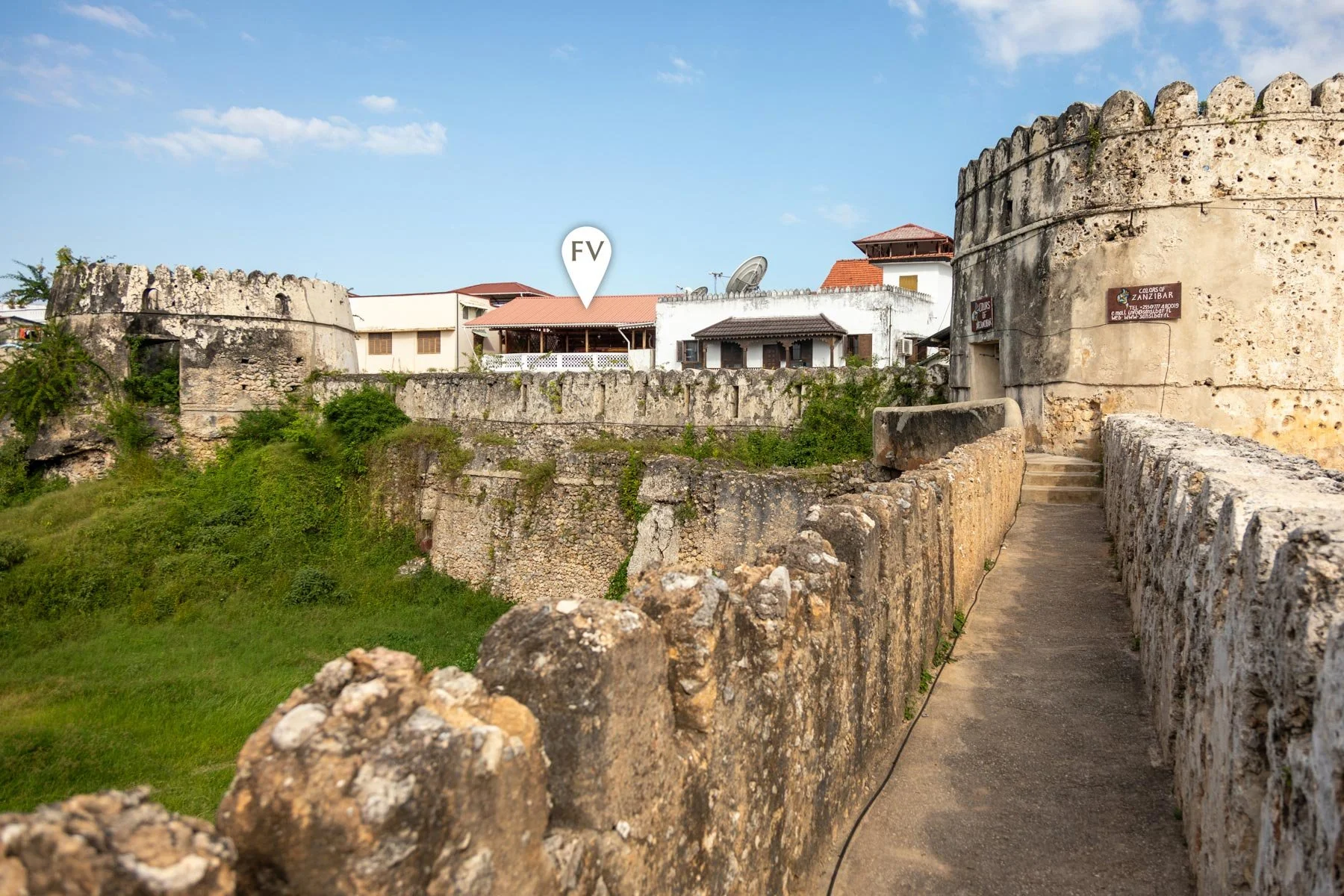 A glimpse of Fort View accommodation behind the walls of the Old Fort. Stone Town, Zanzibar.