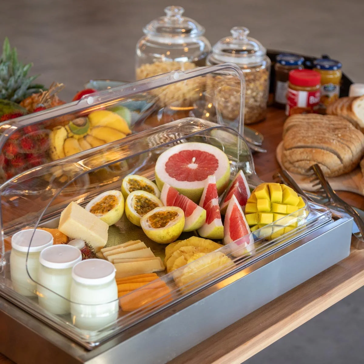Breakfast buffet features fresh fruit, artisanal cheeses, creamy yoghurt, a selection of breads, pastries, and cereals