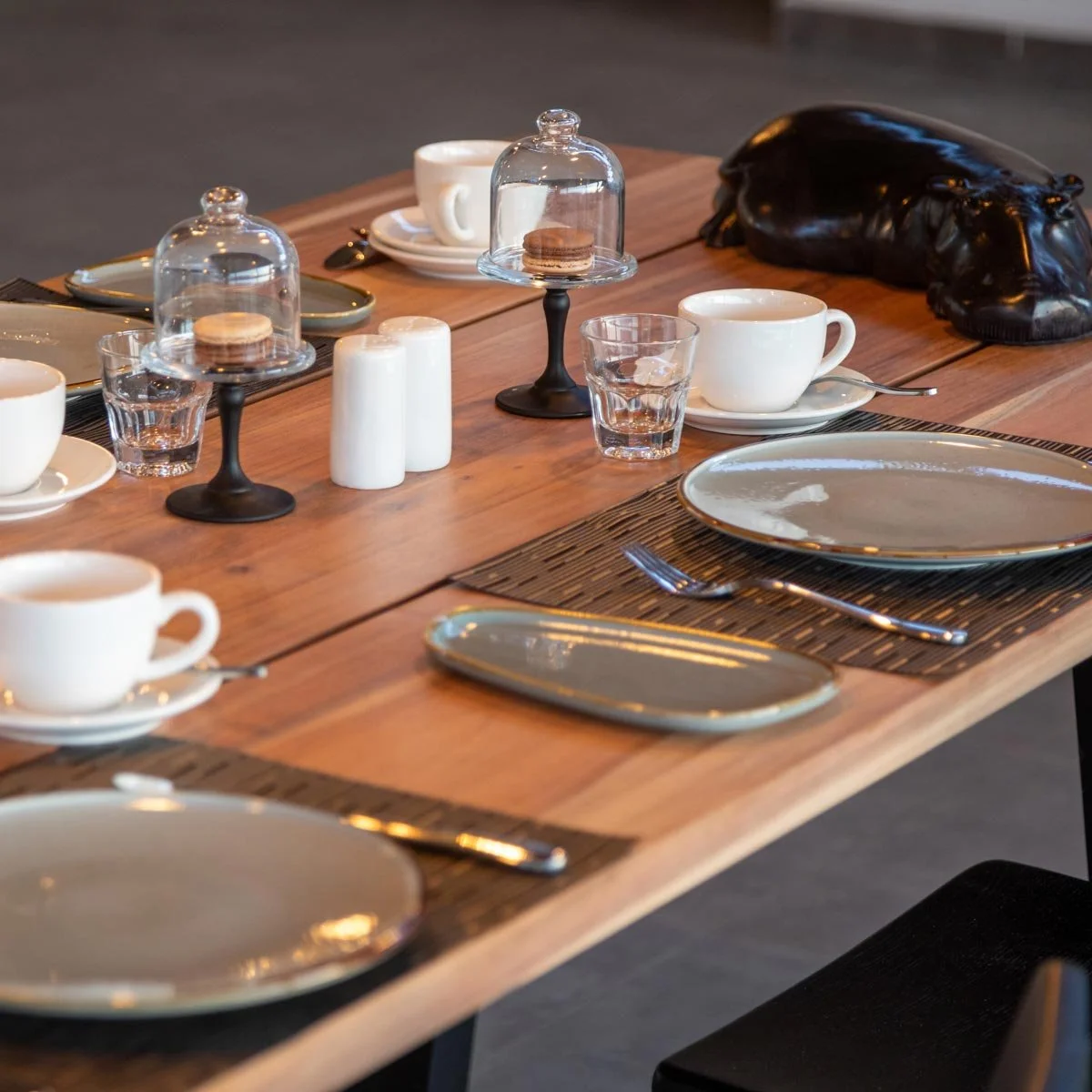 Enjoy stunning views from the upper deck at a beautifully set dining table.
