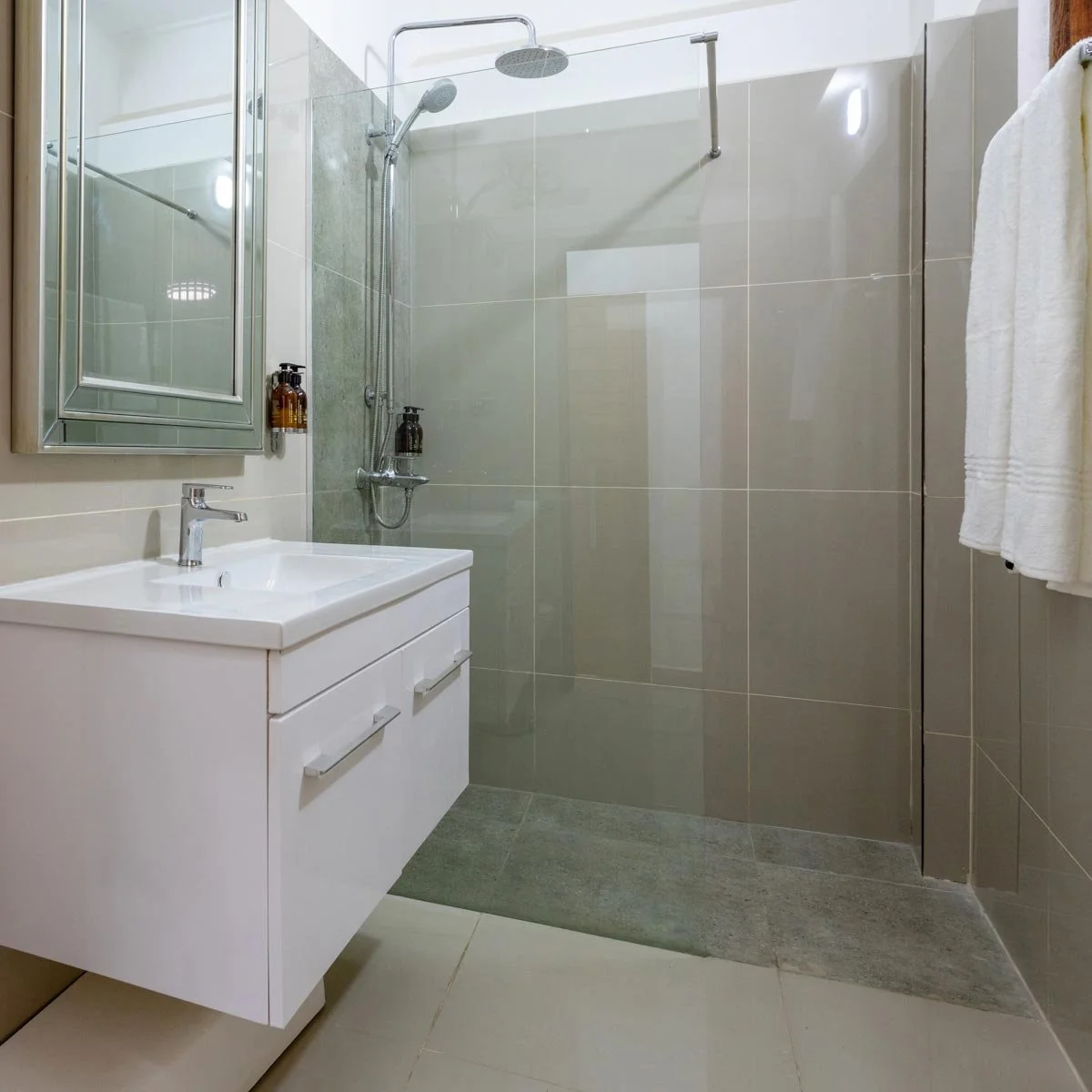 The bathrooms are sleek, modern, and luxurious.