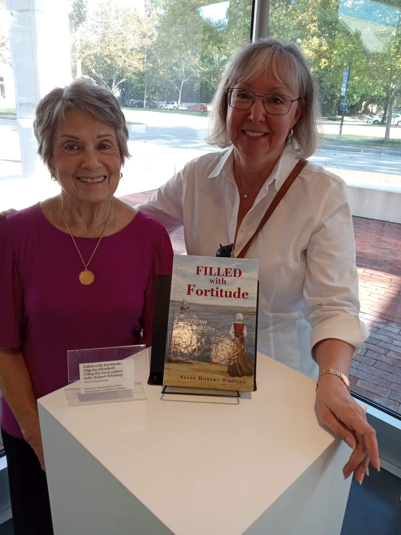 Sally with artist Arlene Haussermann, whose original oil painting appears on the cover of the book.