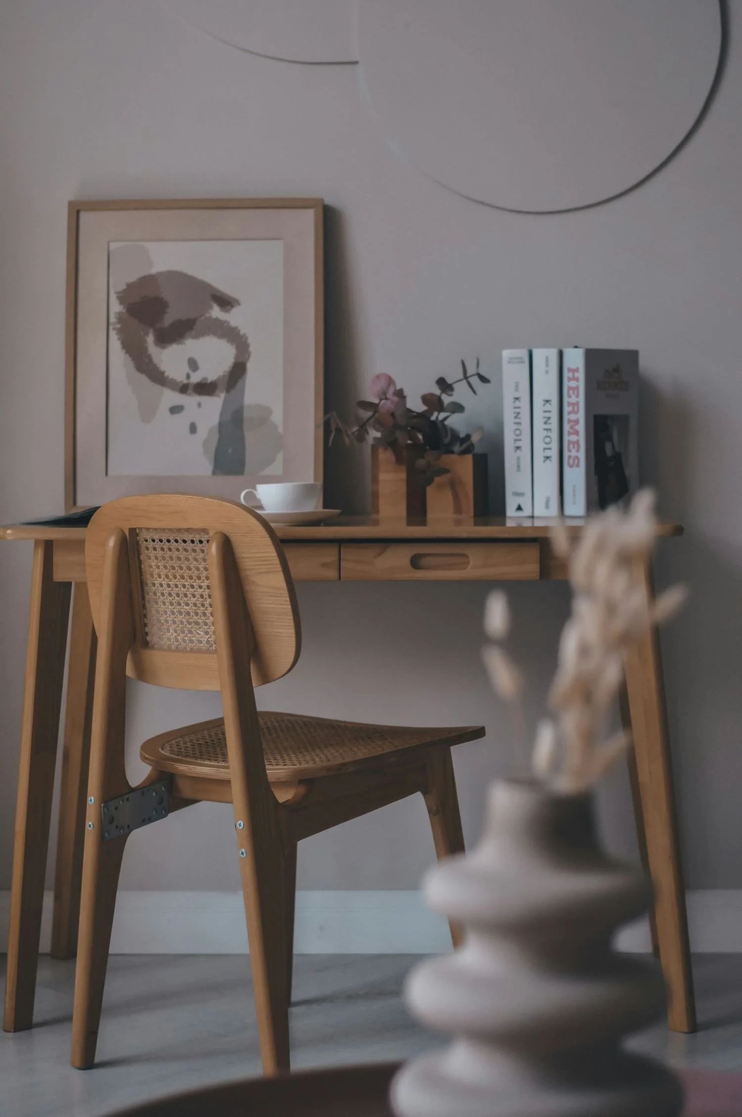 calm office space with desk, books, and coffee