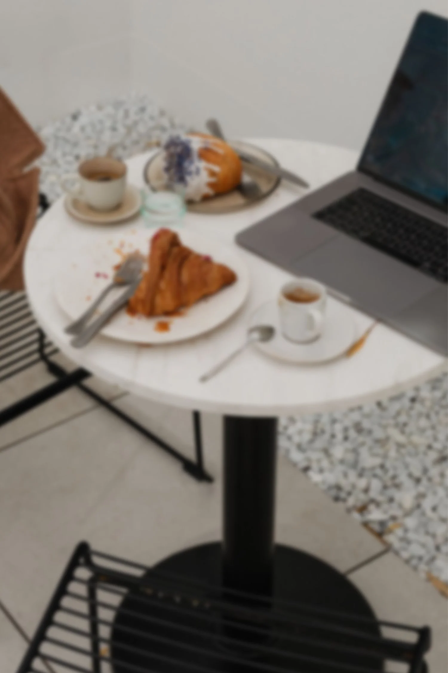 cafe workspace with food and laptop
