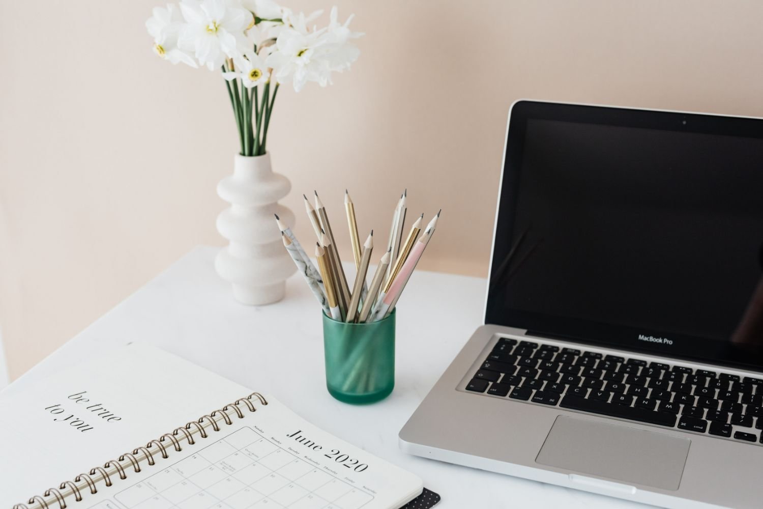minimal office with planner and pencil holder
