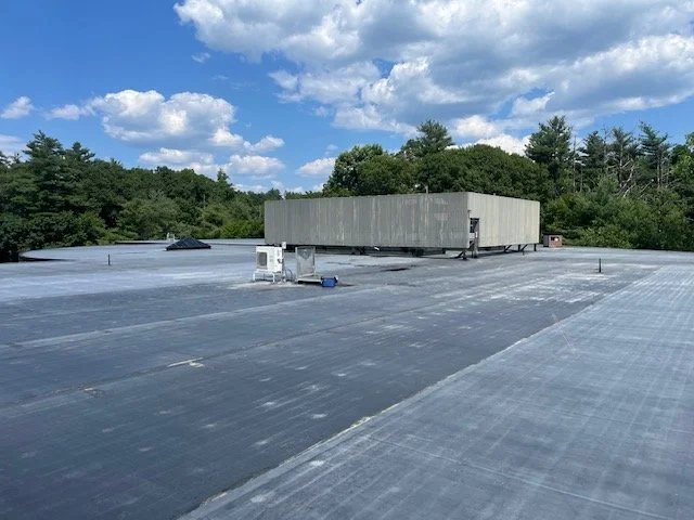 An image of a completed flat roof .
