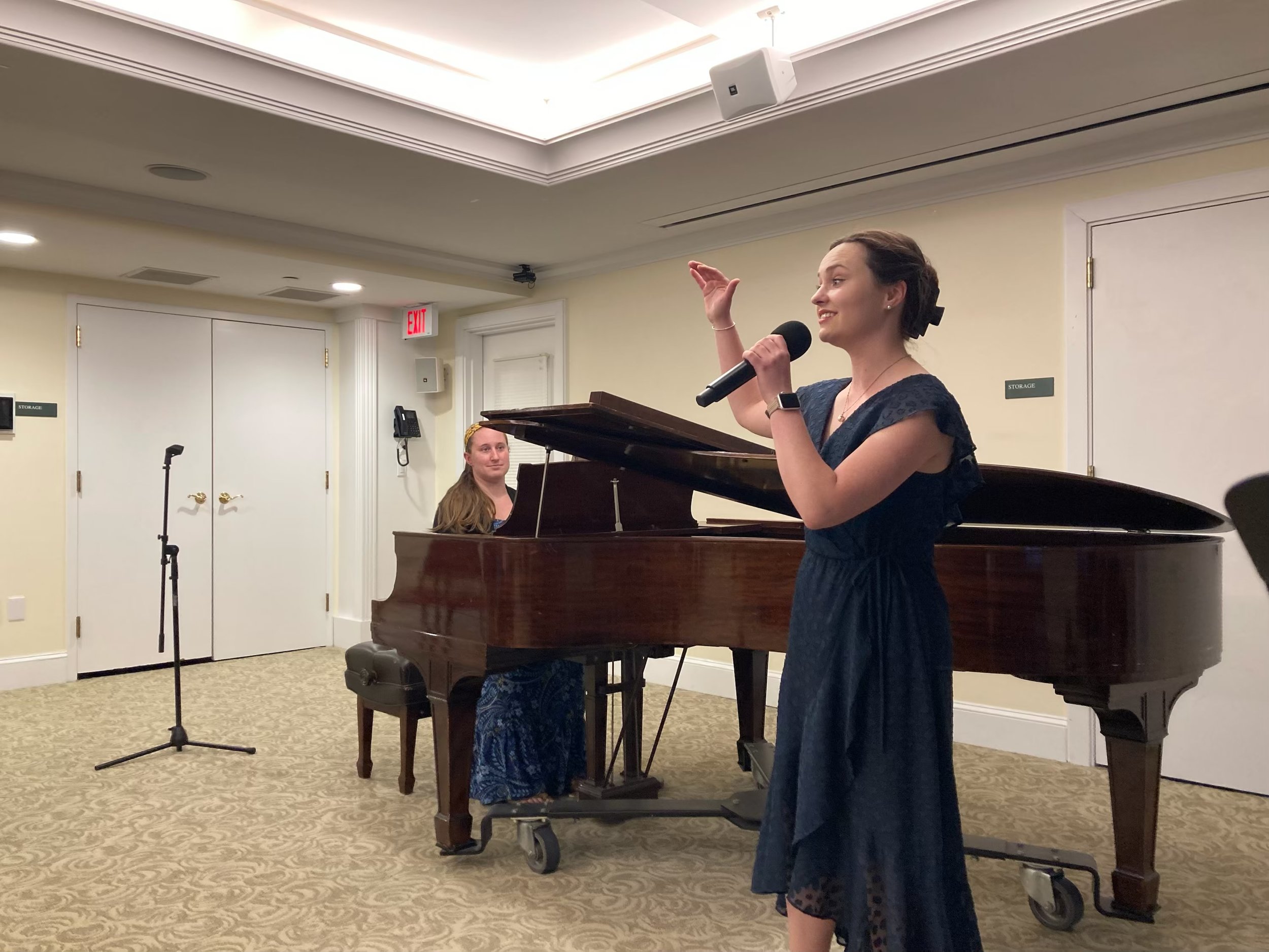 Emma West speaking to the audience at Lasell Village