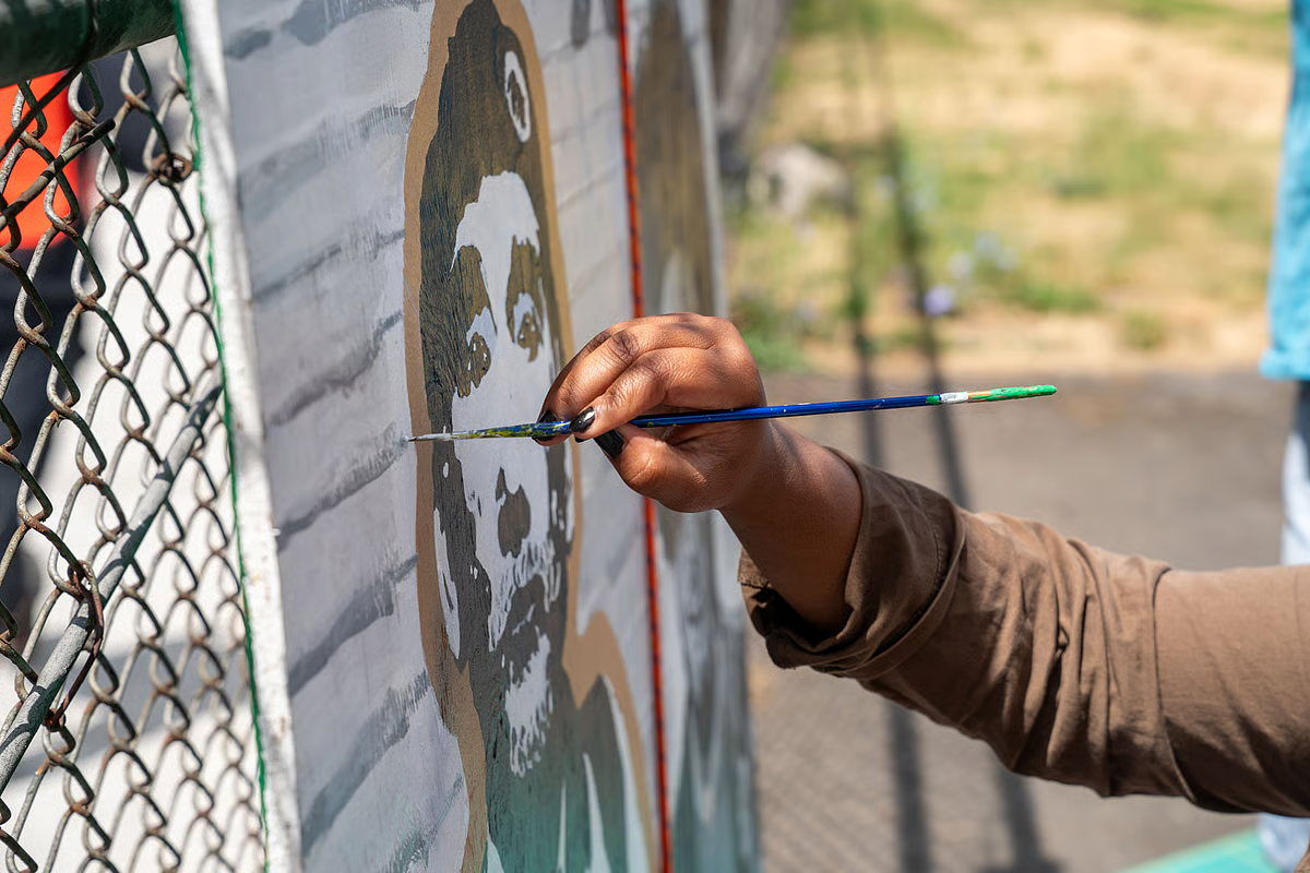 Vandalized Black Panther Mural at Franklin High School Gets a Glow-Up