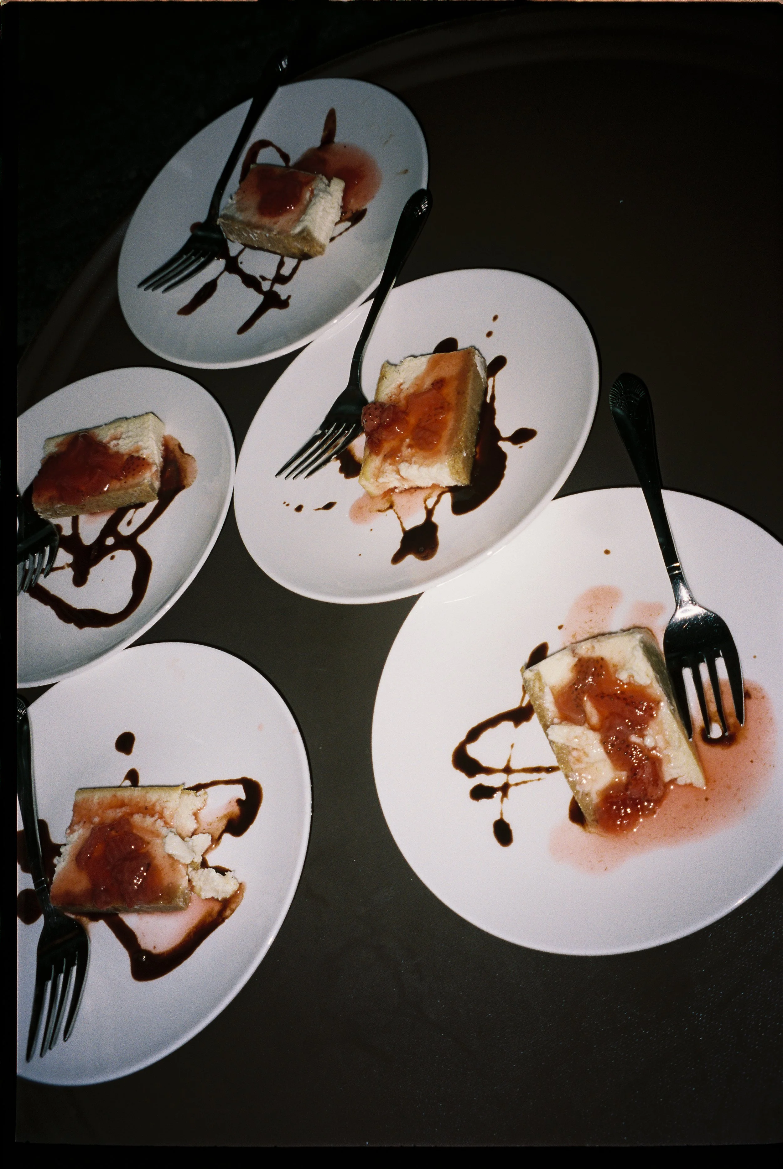 Individual plated wedding desserts with caramel topping and chocolate drizzle served during a wedding reception.