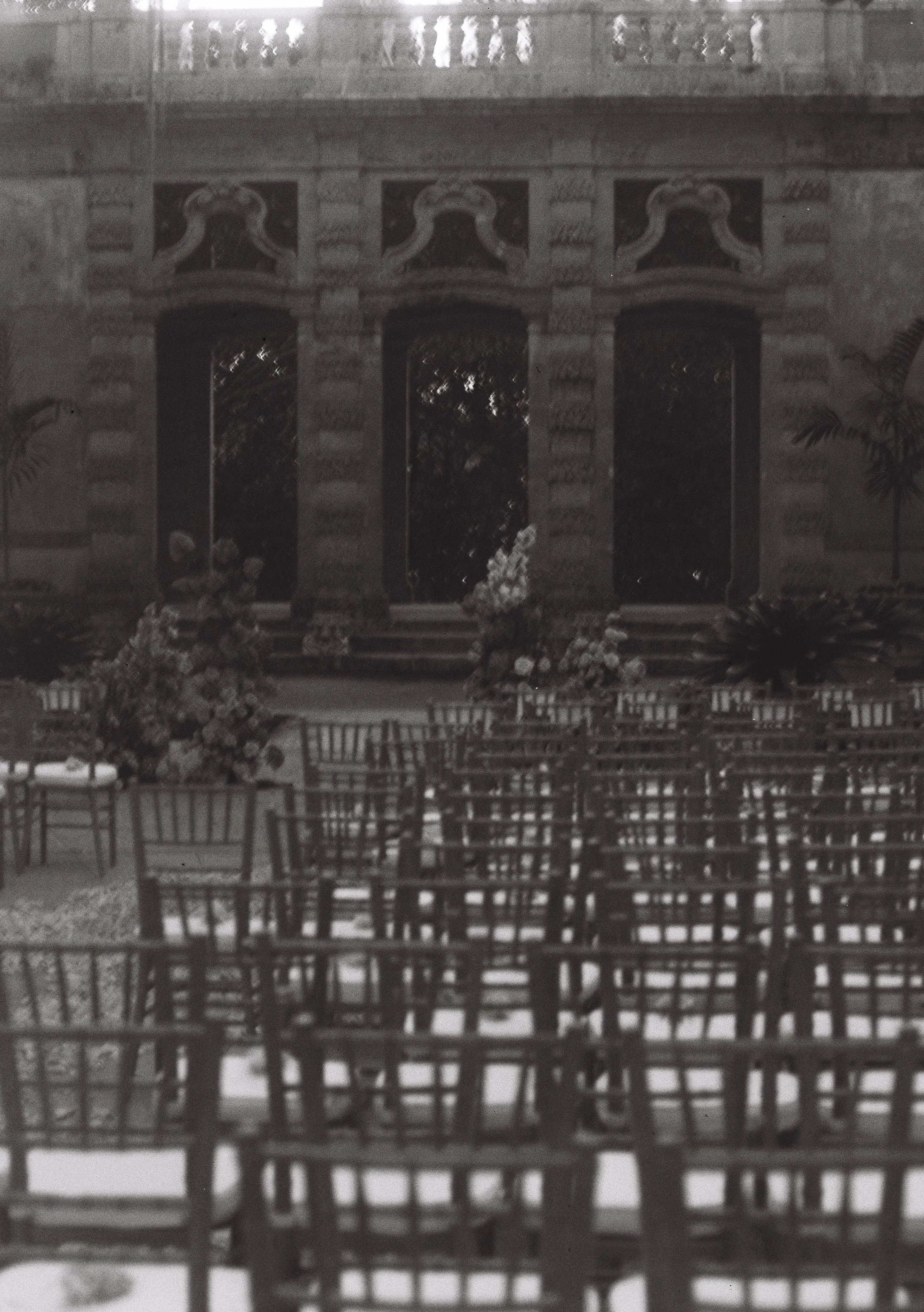 Rows of ceremony chairs arranged in the historic garden courtyard at Vizcaya Museum and Gardens before guests arrive.