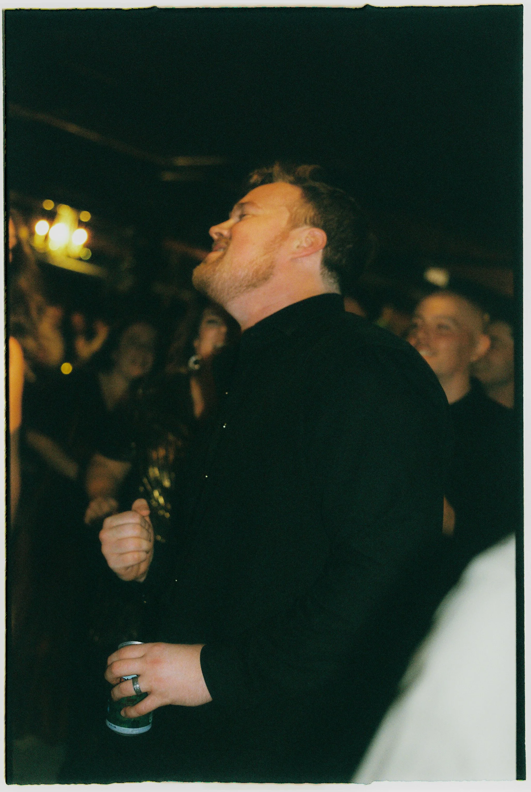 Groom singing and dancing during a lively wedding reception moment