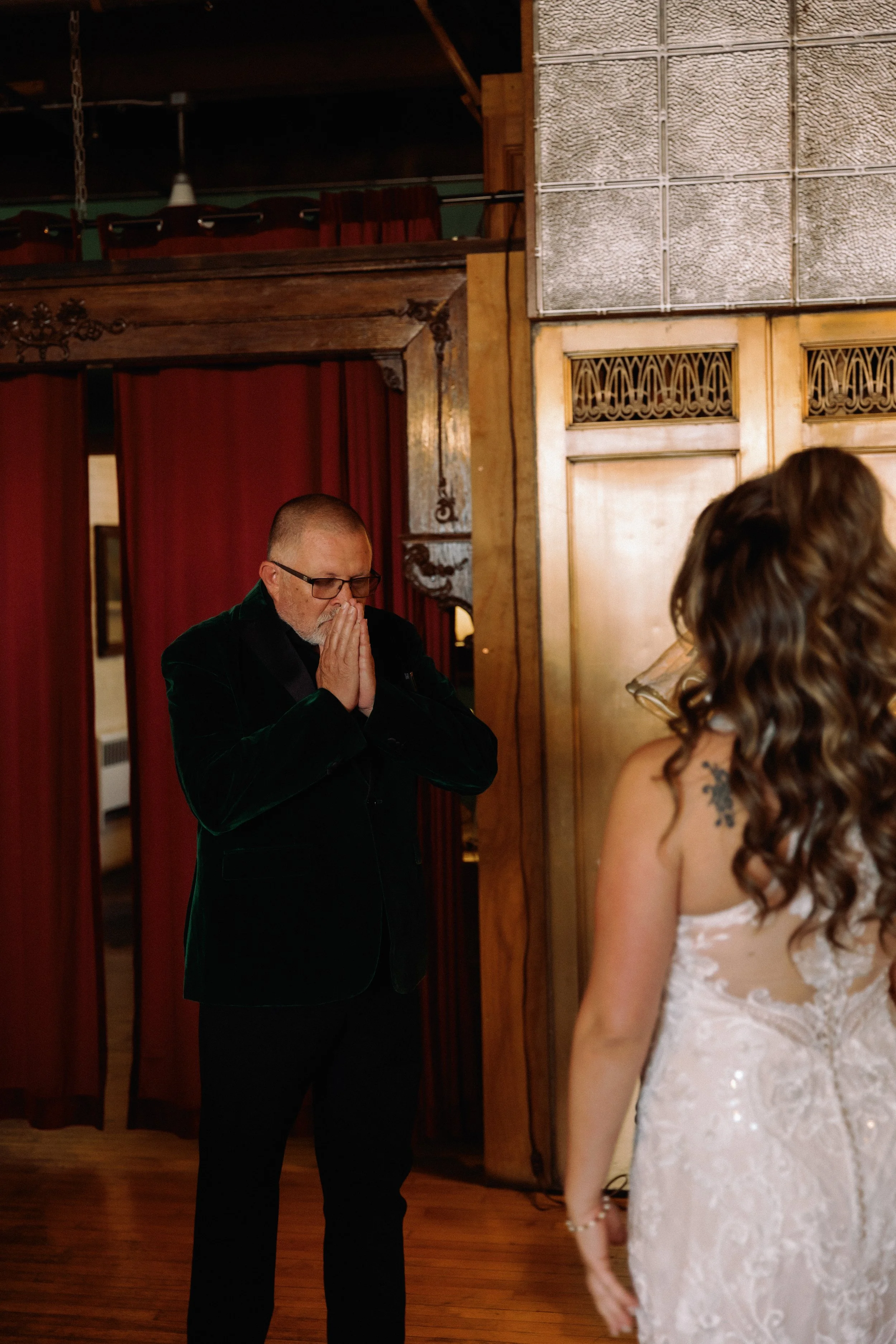 Emotional first look moment as a father reacts to seeing the bride in her wedding dress