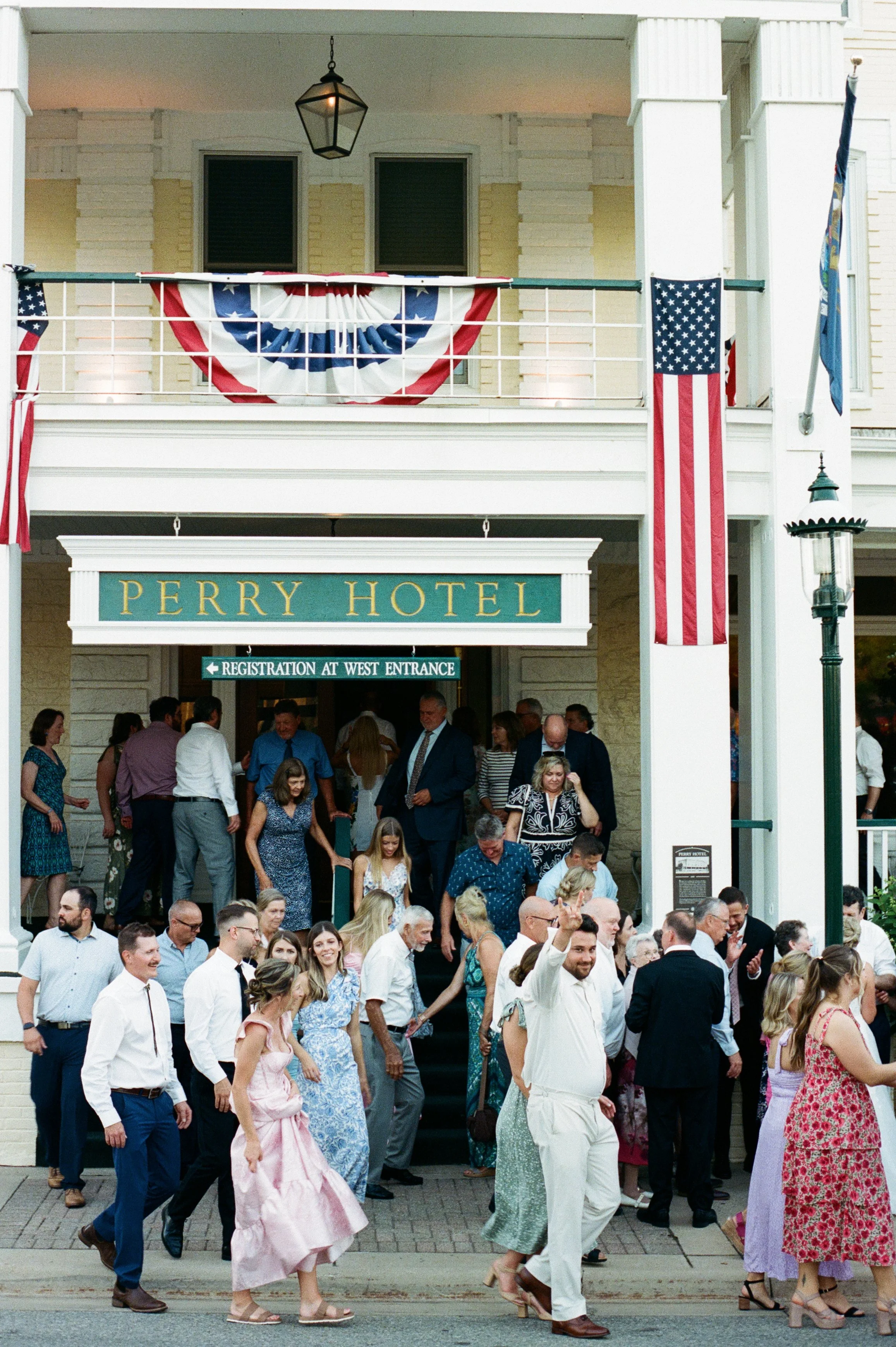 Wedding guests gathering outside Stafford's Perry Hotel following the ceremony in downtown Petoskey.