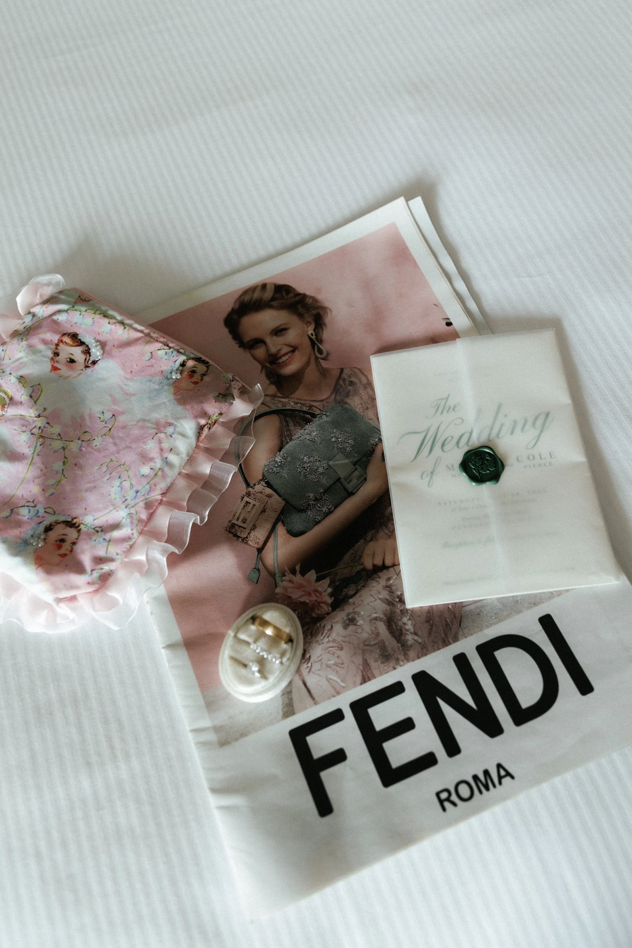 Wedding inspiration details featuring bridal accessories, fashion magazines, and invitation styling.