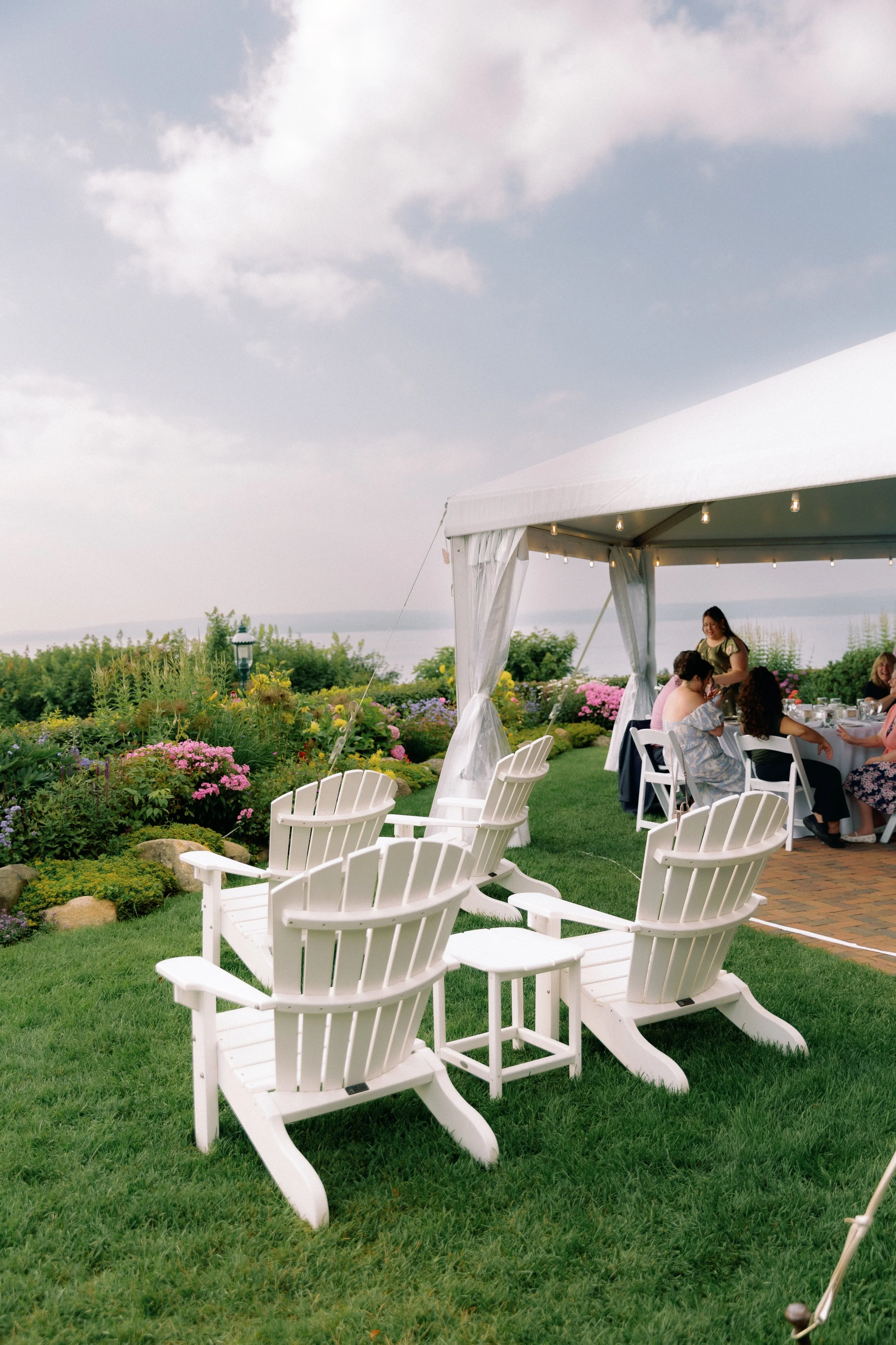 Garden seating and reception tent overlooking Lake Michigan at Stafford's Perry Hotel.