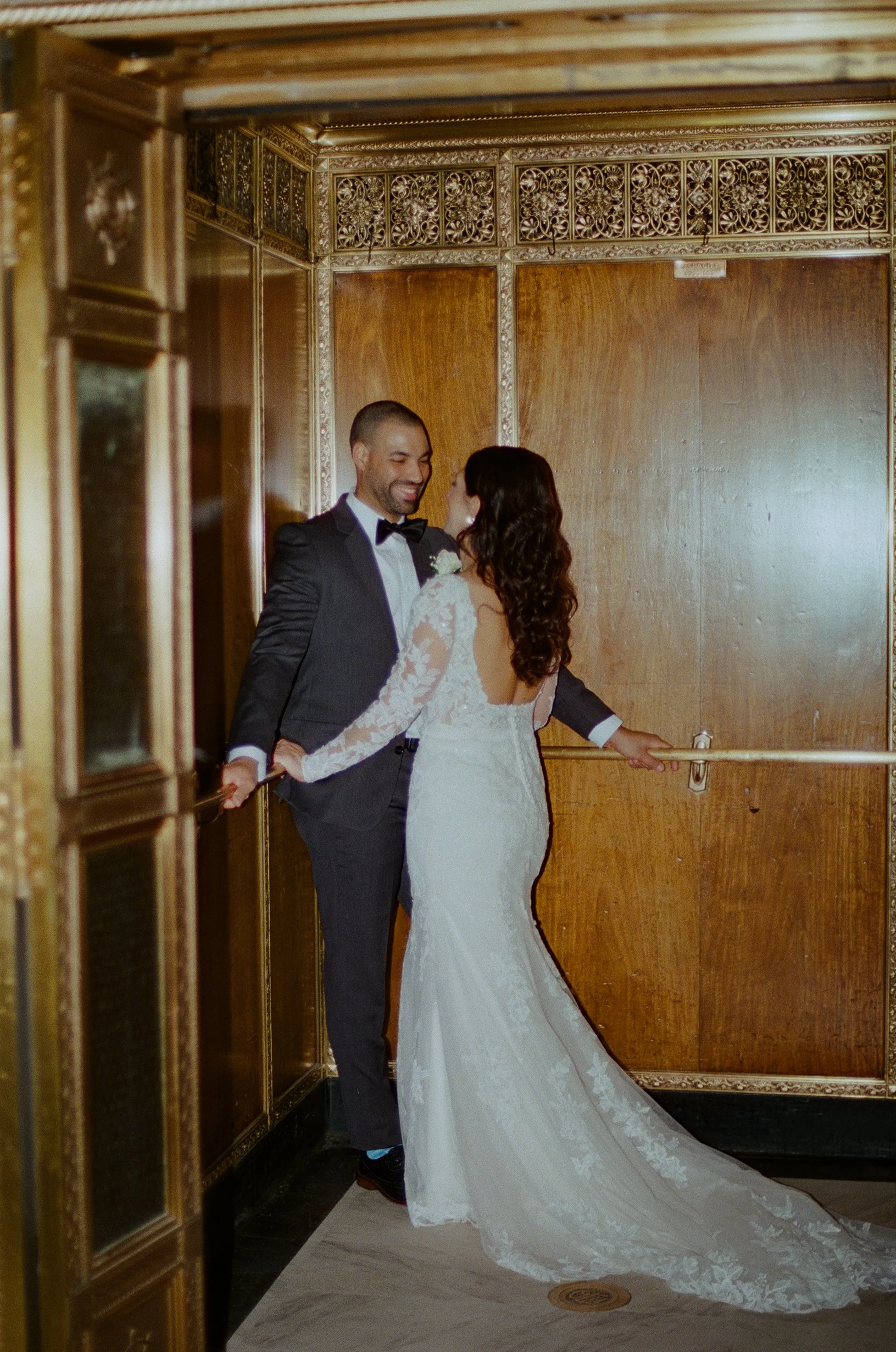 A bride and groom portrait in an elevator at their downtown Detroit wedding