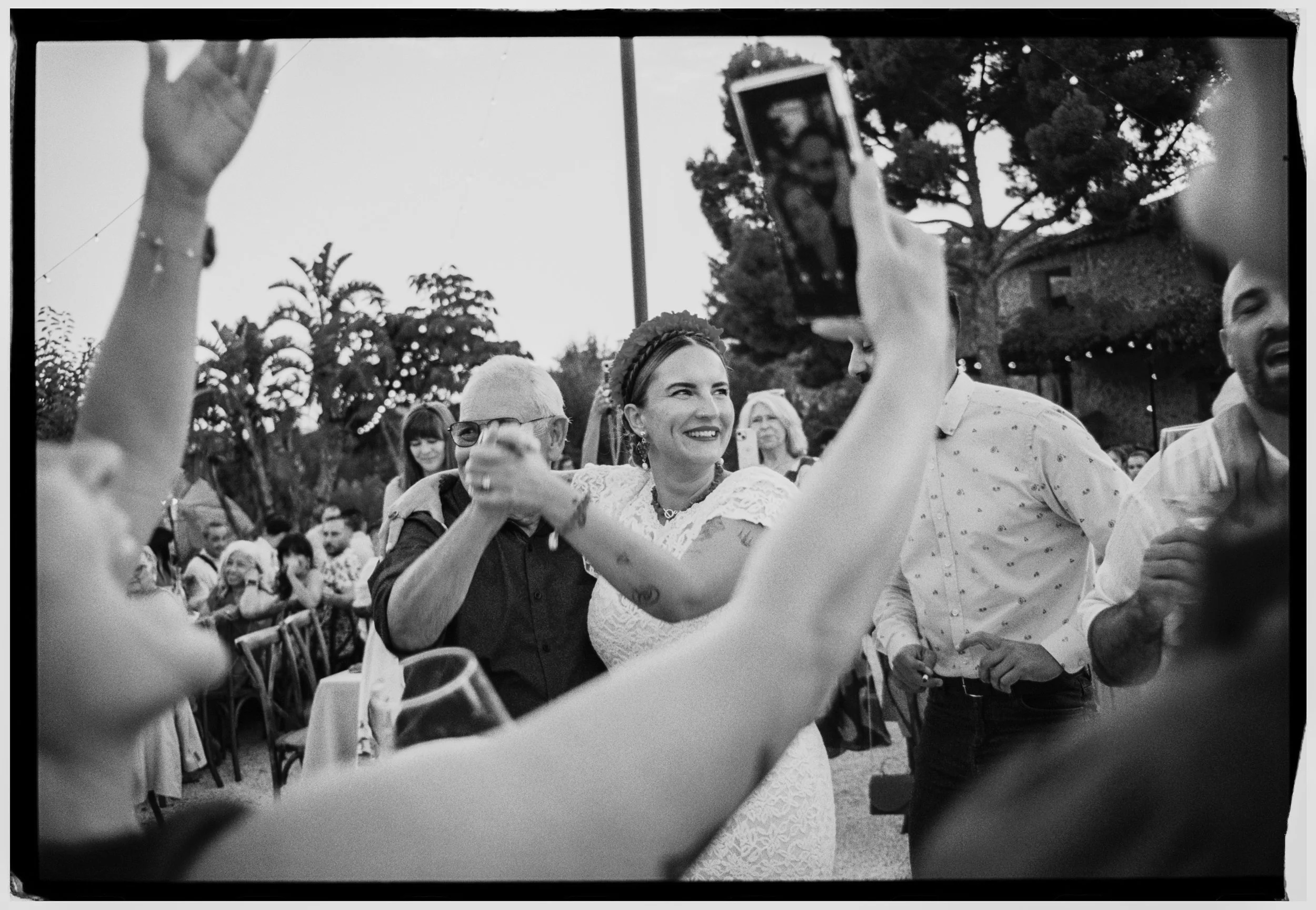 Bride dancing with a family member during the wedding reception celebration.