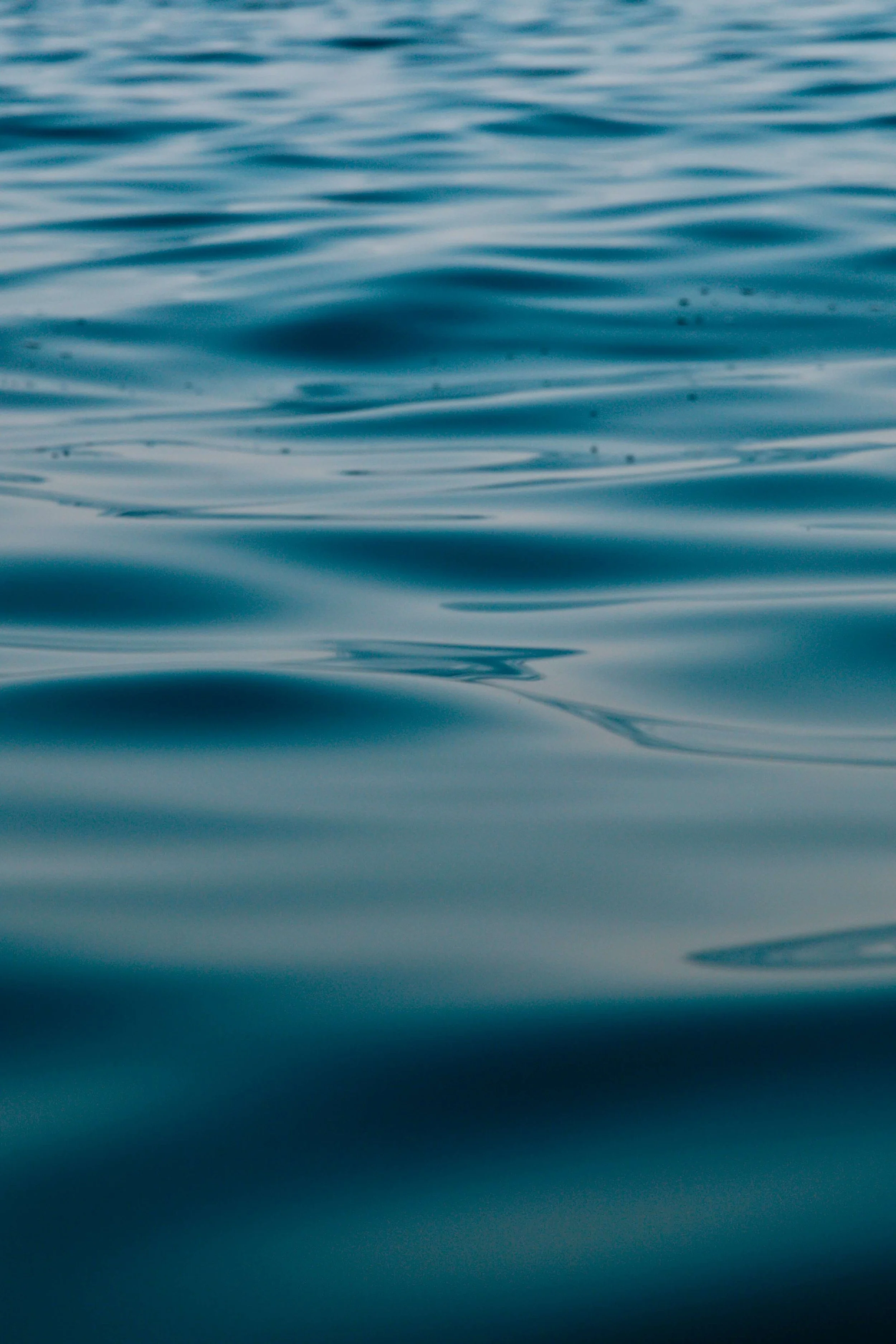 Close-up of calm blue ocean water with gentle ripples on the surface.