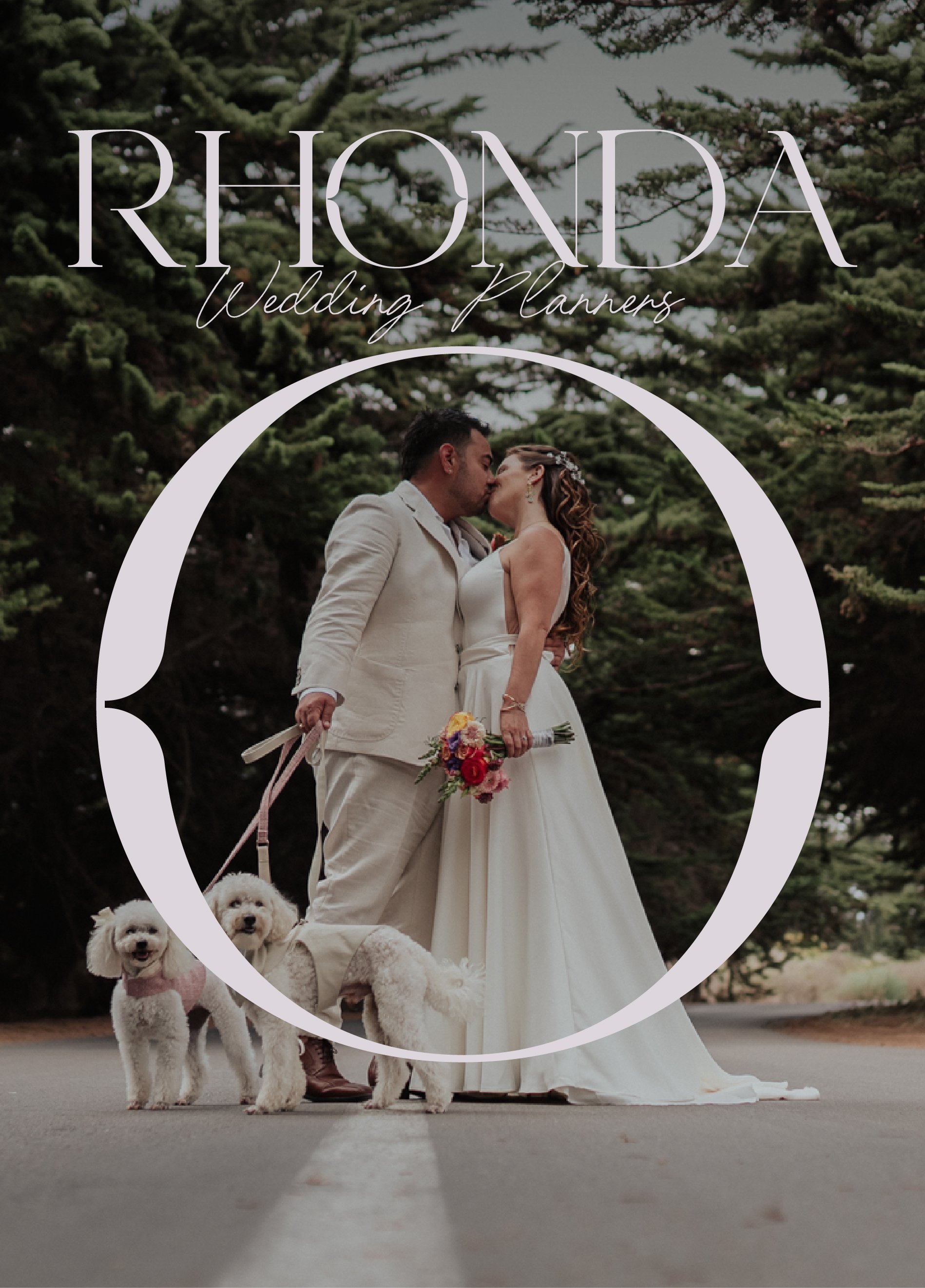 Wedding planners Rhonda's promotional image showing a couple in wedding attire kissing outdoors on a road, with two dogs at their feet, surrounded by tall green trees.