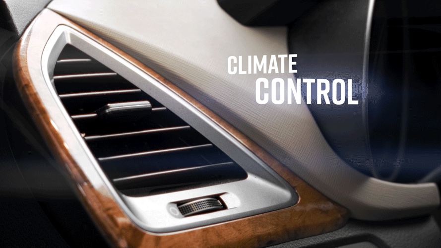 Close-up of a car's interior air vent with the words 'Climate Control' overlayed.