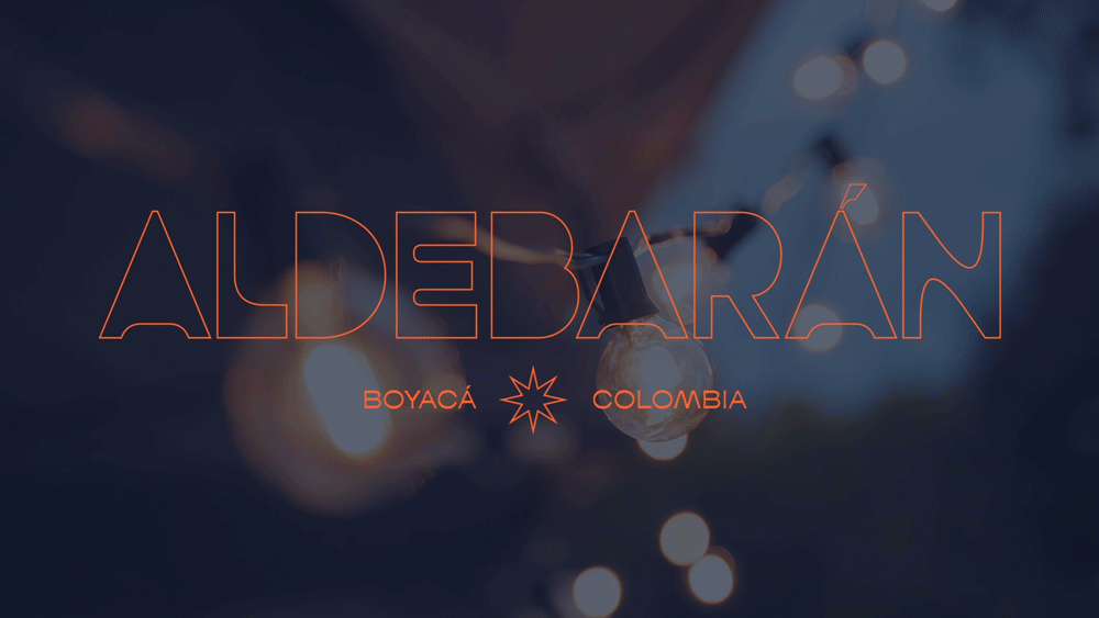 Text overlay on blurred background reads 'ALDEBARÁN BOYACÁ COLOMBIA' with an orange star-shaped symbol between the words 'BOYACÁ' and 'COLOMBIA'.