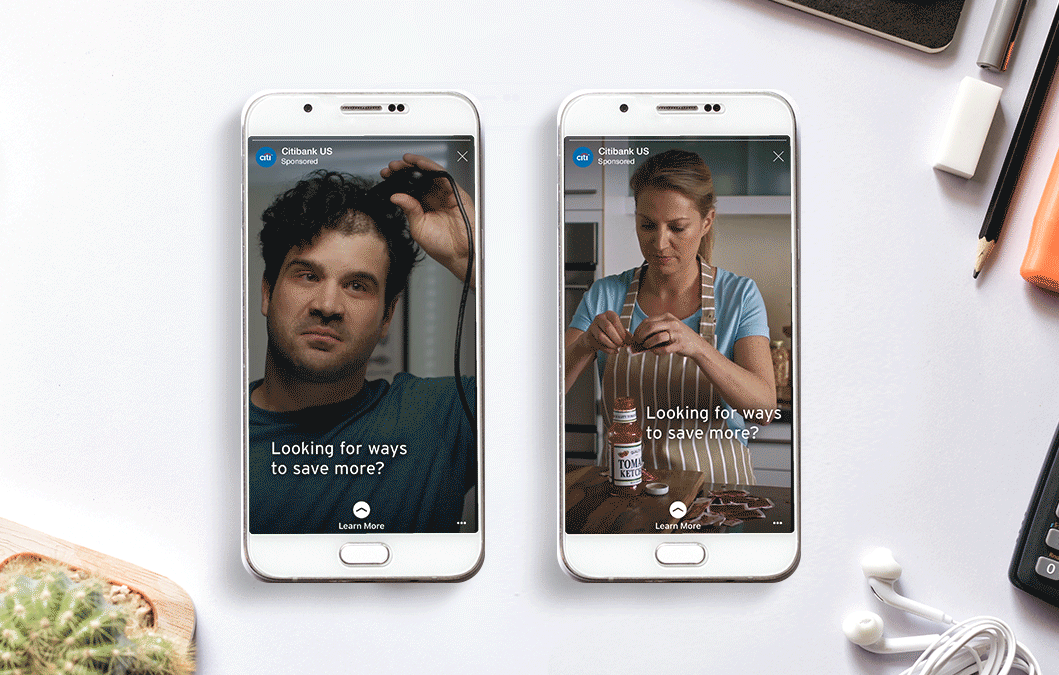 Two smartphones on a white desk, one showing a man with curly hair and the other a woman with a ponytail in a kitchen, both with advertisements asking "Looking for ways to save more?"