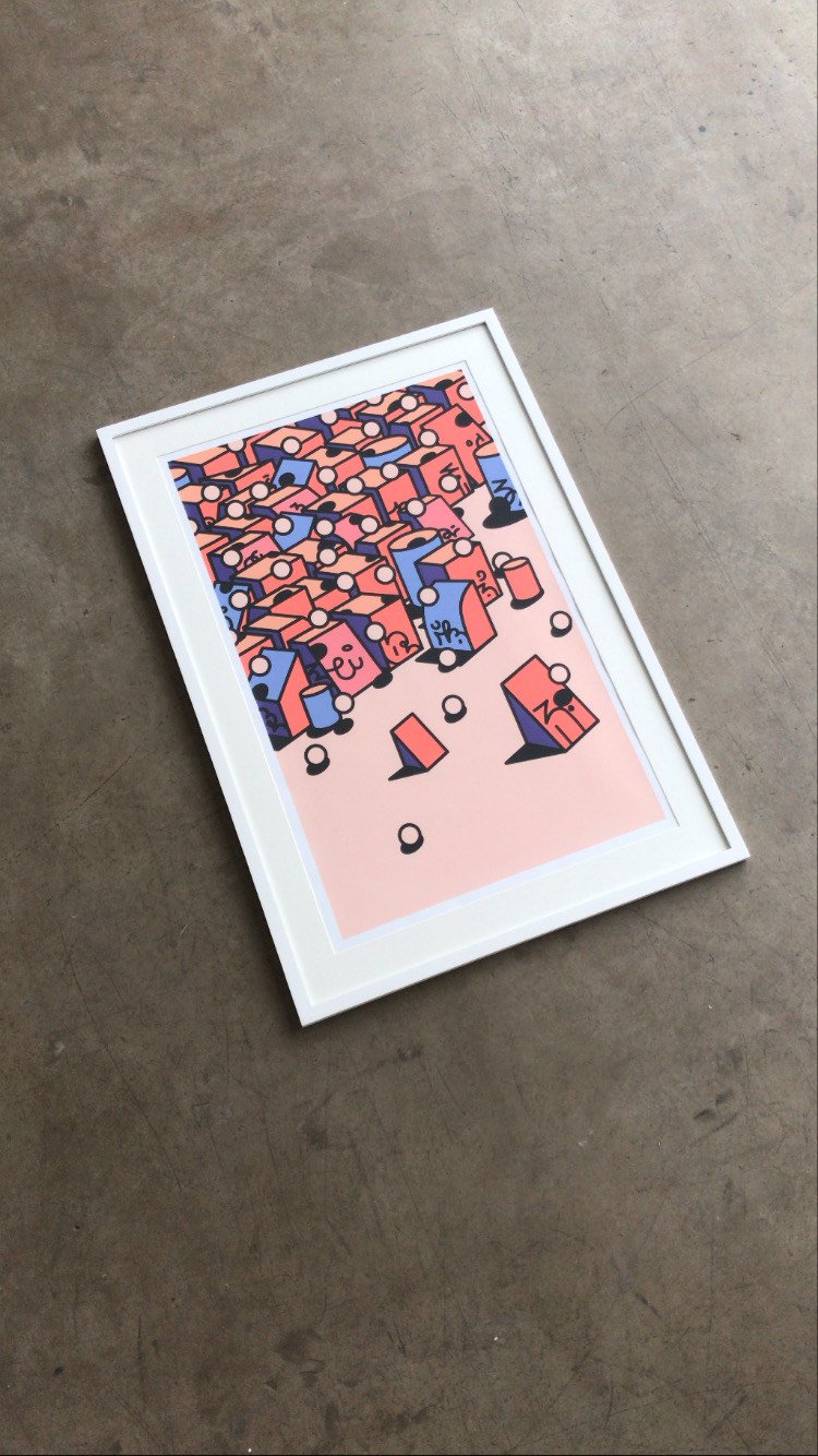 Framed abstract geometric artwork with pink, blue, peach, and black shapes, placed on a concrete surface.