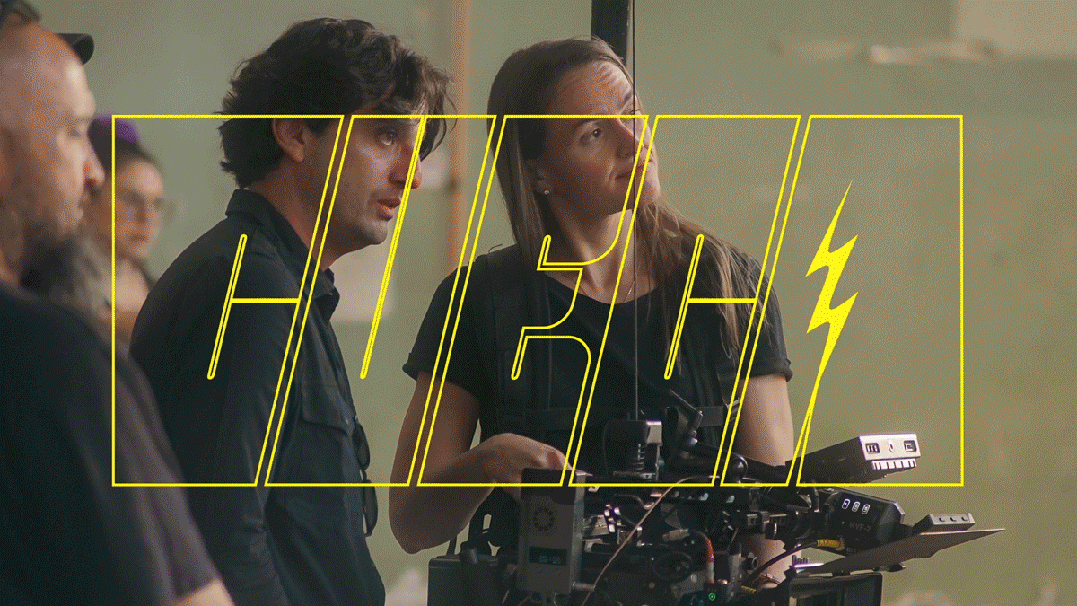 People on a film set with a camera and a digital overlay of the word 'HIGH' with lightning bolt symbols.