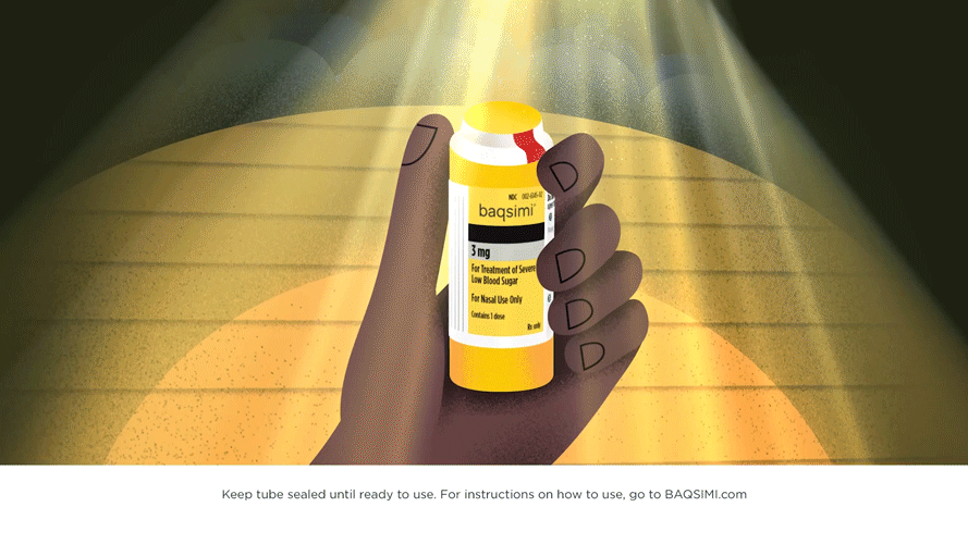 A hand holding a yellow medication bottle labeled "baqsimi" with a white, yellow, and red cap, illuminated by a spotlight against a dark background.