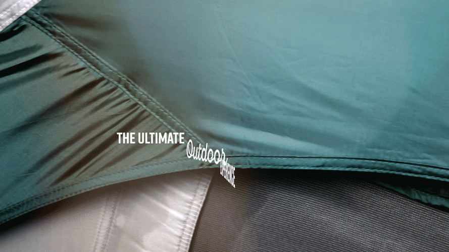 Close-up of outdoor clothing or tents with text 'THE ULTIMATE Outdoor' printed on the fabric.