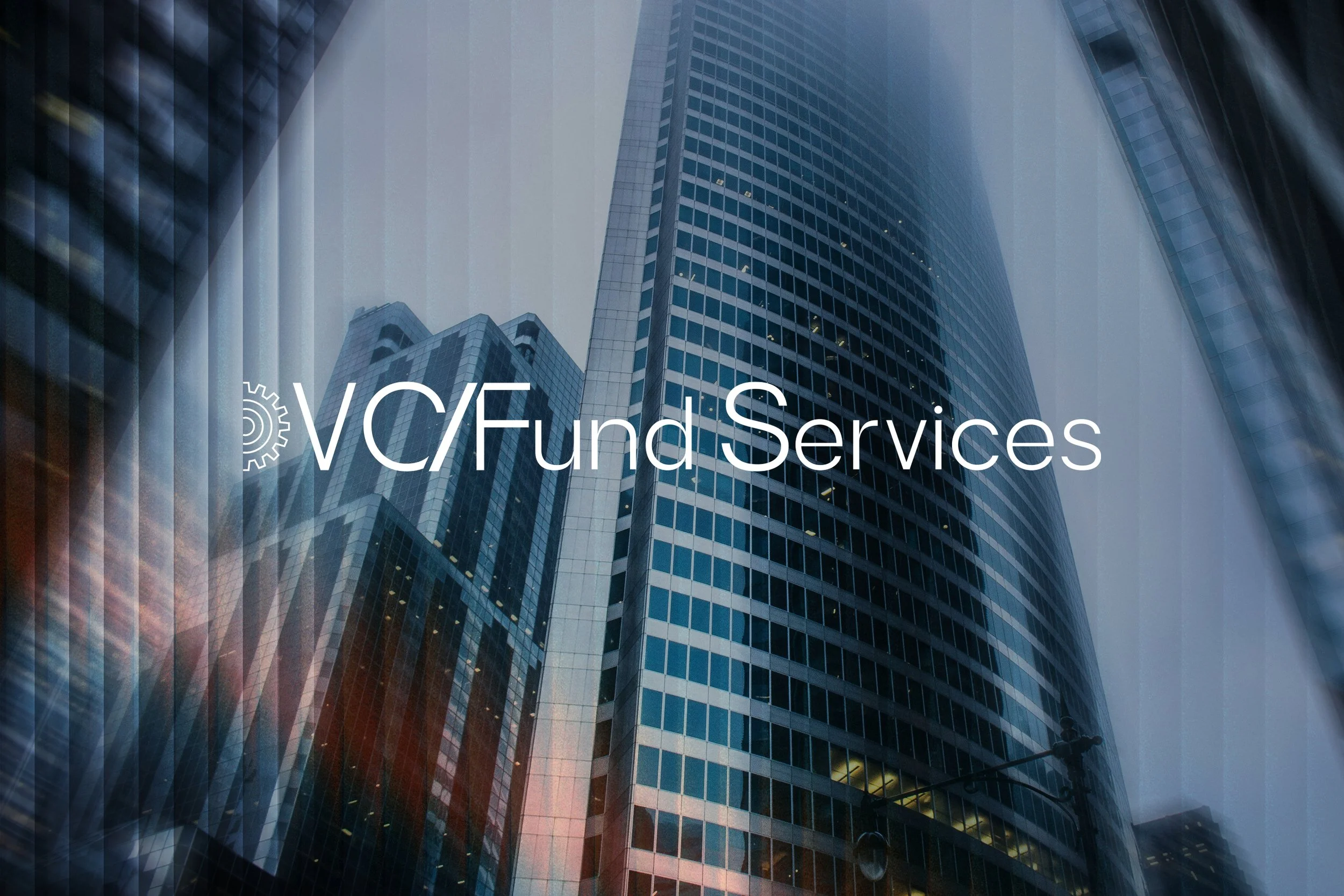 Reflections of tall modern office buildings on a glass window with text 'VC/FC fund services' overlayed.