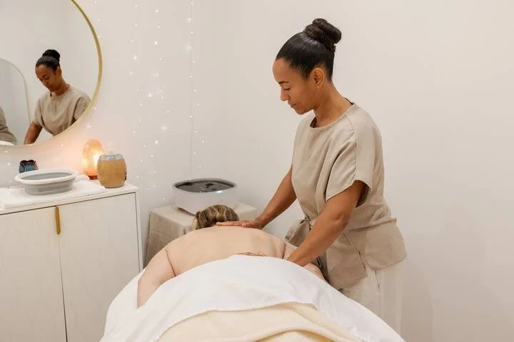 Natasha applying the oil to the back