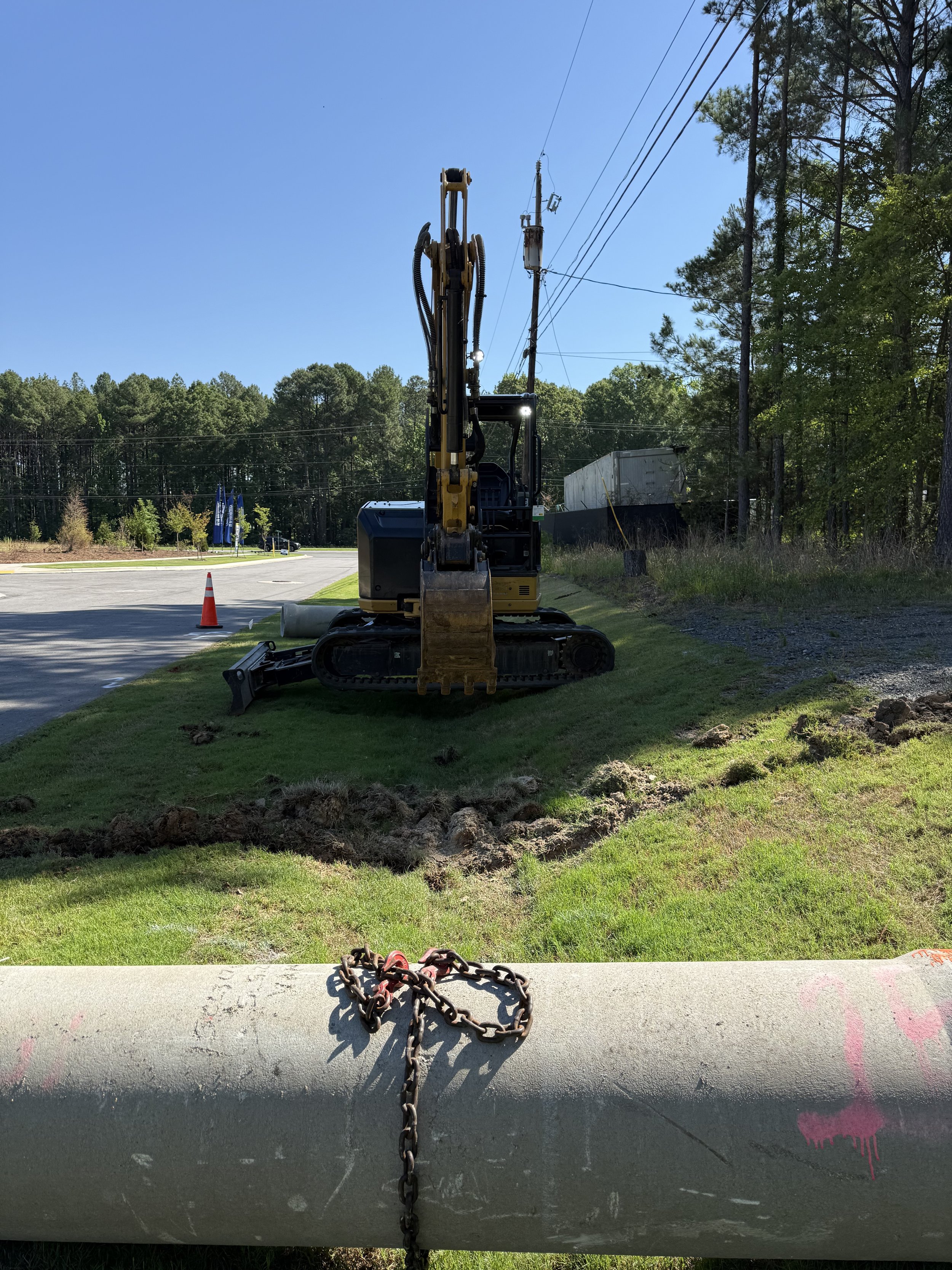 Creating a level ditch for drainage pipe to be properly placed.