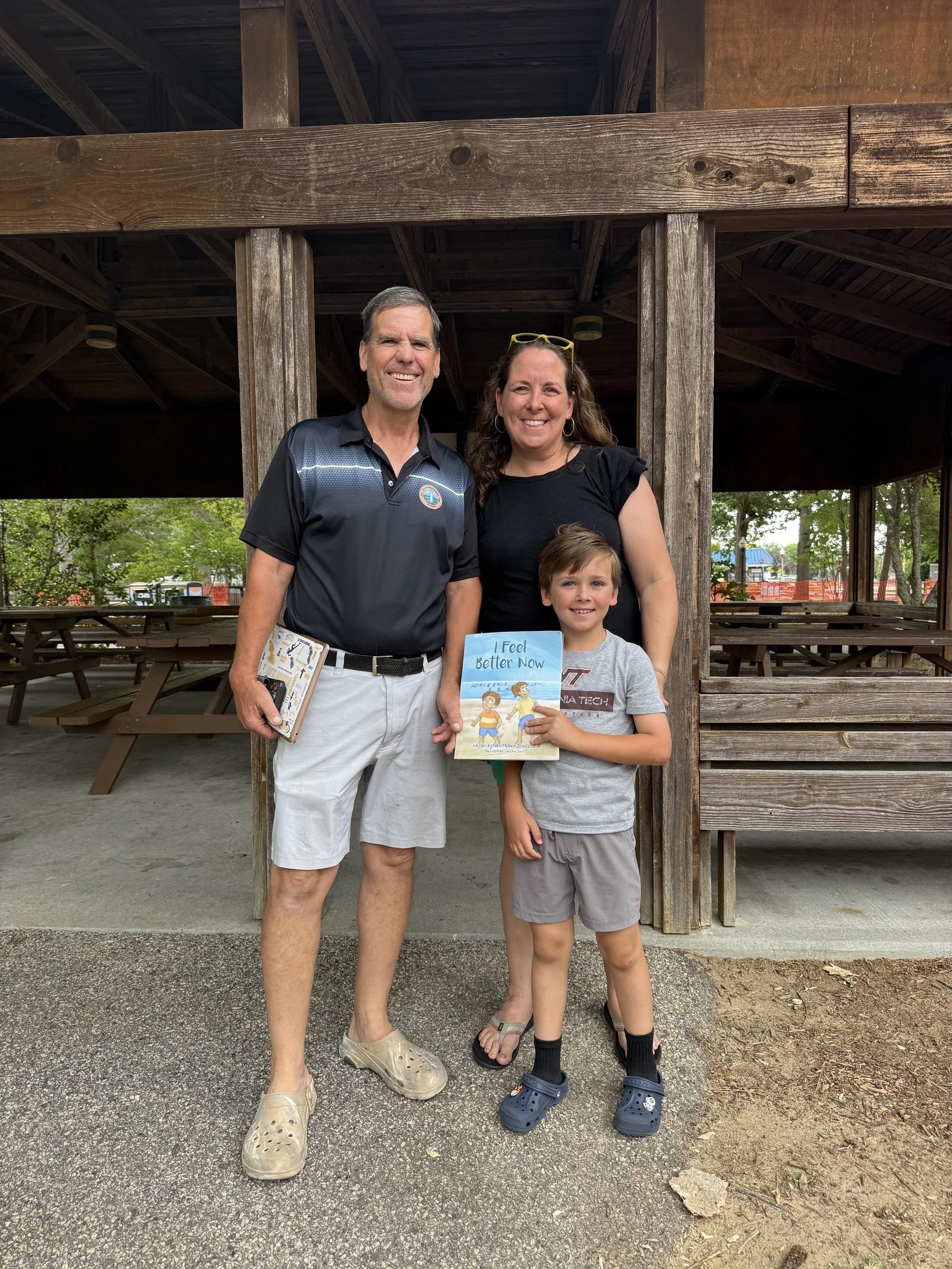 Coach Tim Bamforth with school teacher Jodie Daminger and her son, Austin.
