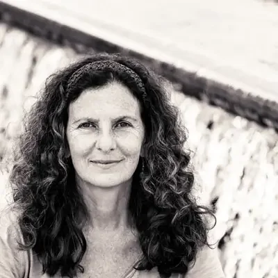 Black-and-white portrait of a Cheryl Pallant, author, Reiki healer, and writing coach.