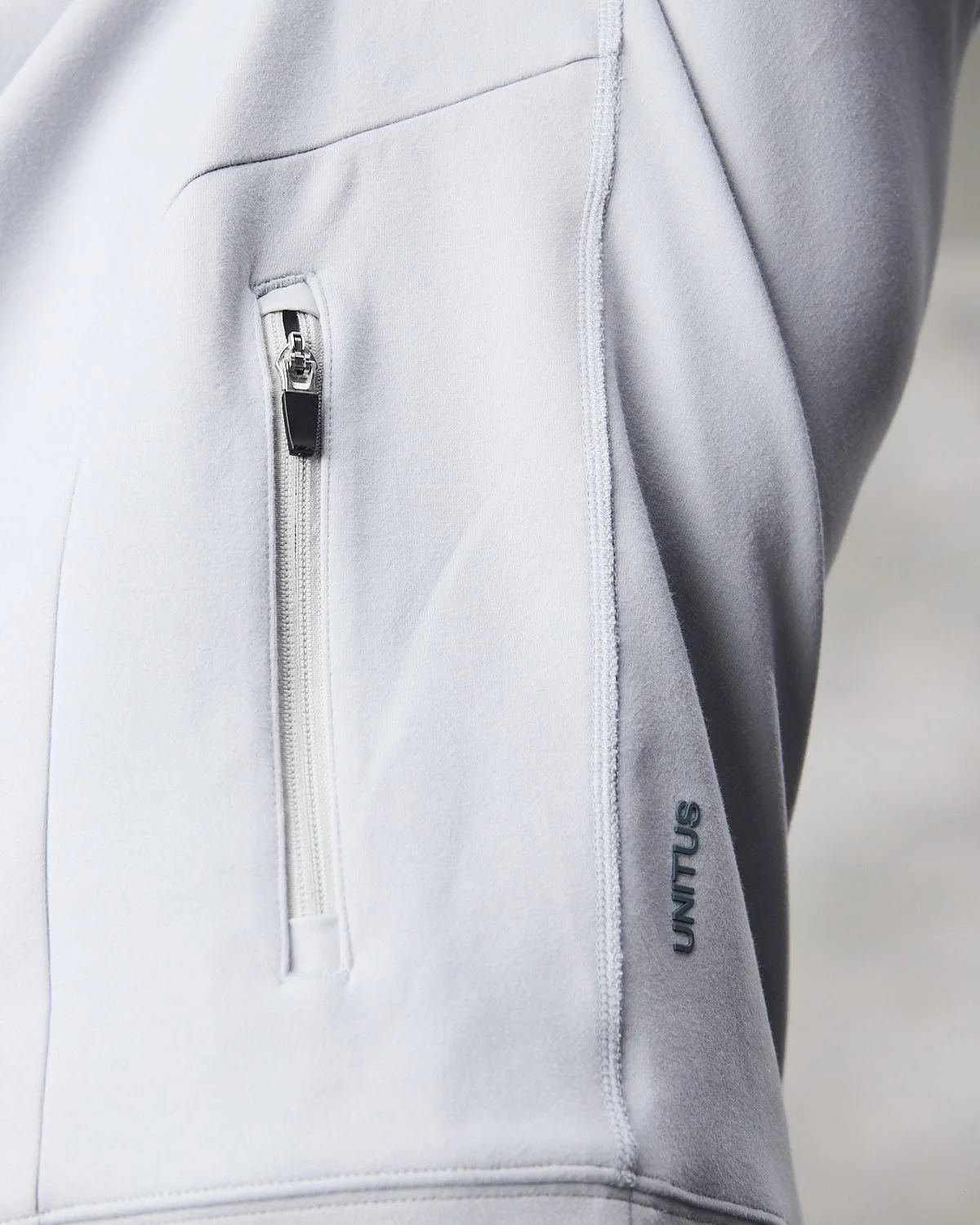 White jacket detail, photographed with clean studio lighting