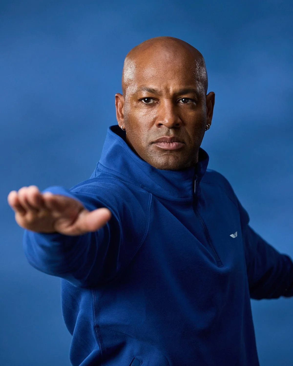 Men’s athletic blue jacket, photographed with clean studio lighting