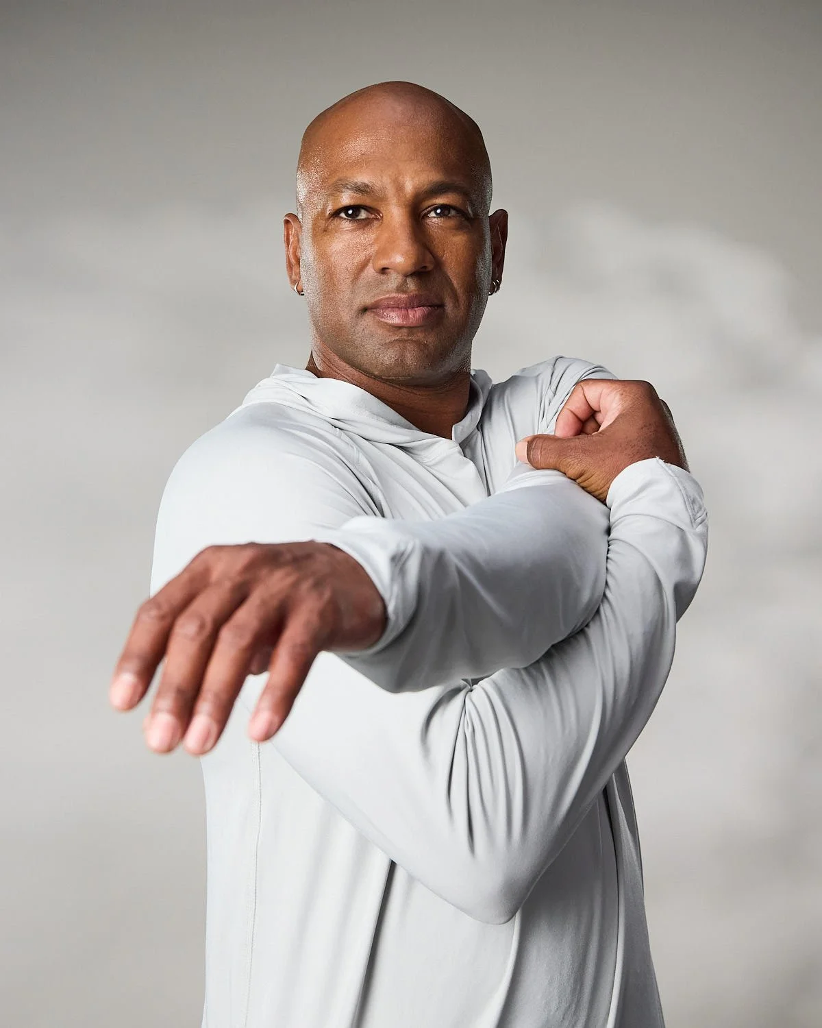 Men's white athletic jacket, photographed with clean studio lighting