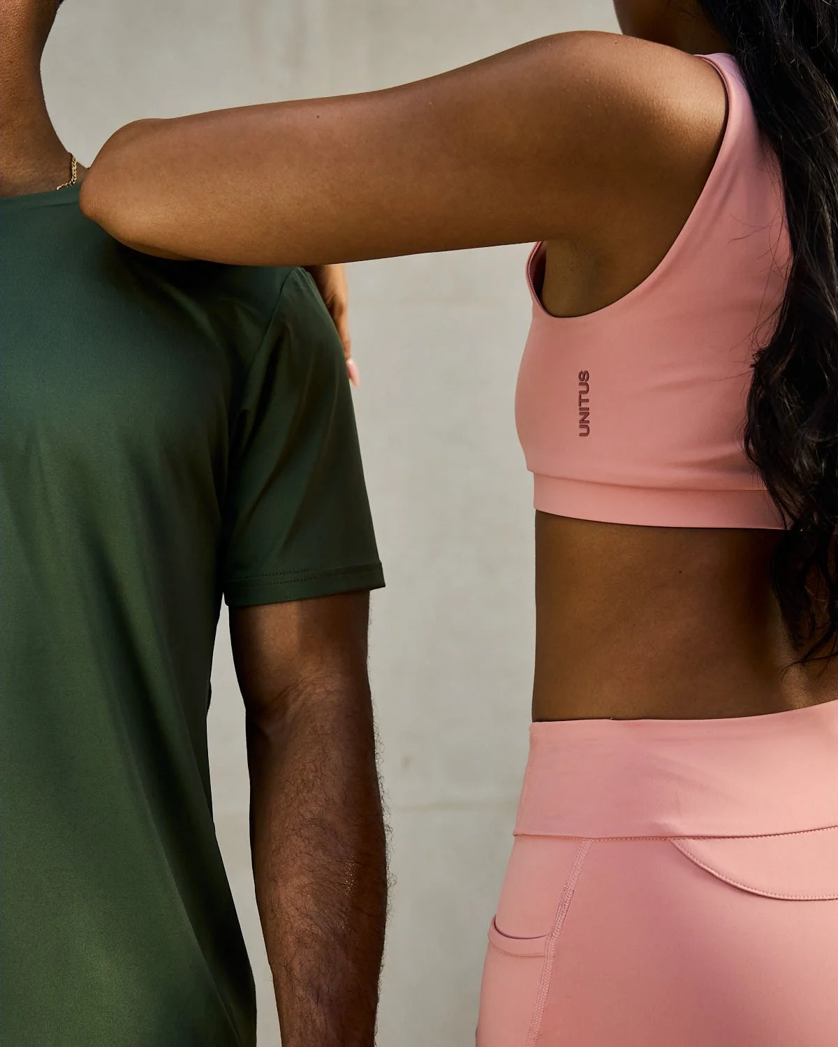 Commercial lifestyle shot of athletes in Unitus sportswear posing in studio, beautiful lighting