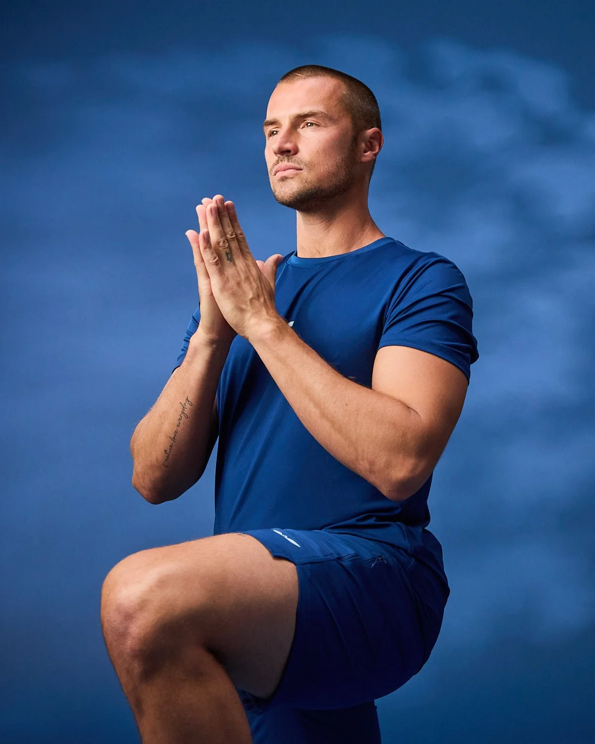 Mens blue shirt, photographed with clean studio lighting with blue backdrop
