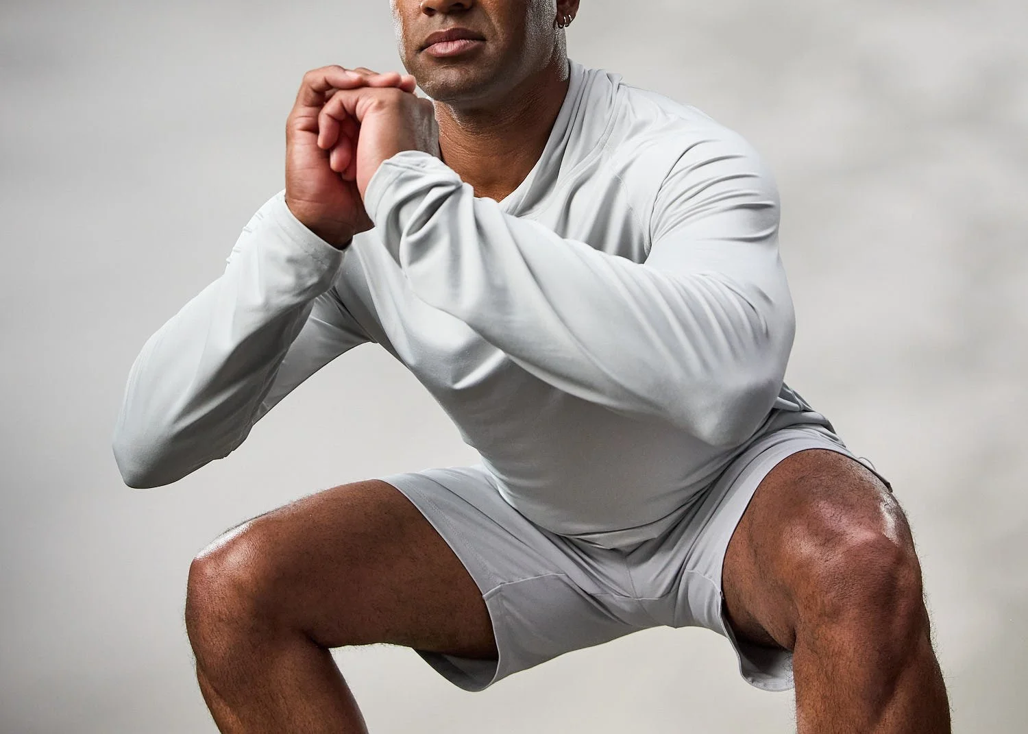 Men's white athletic hoodie, photographed with clean studio lighting